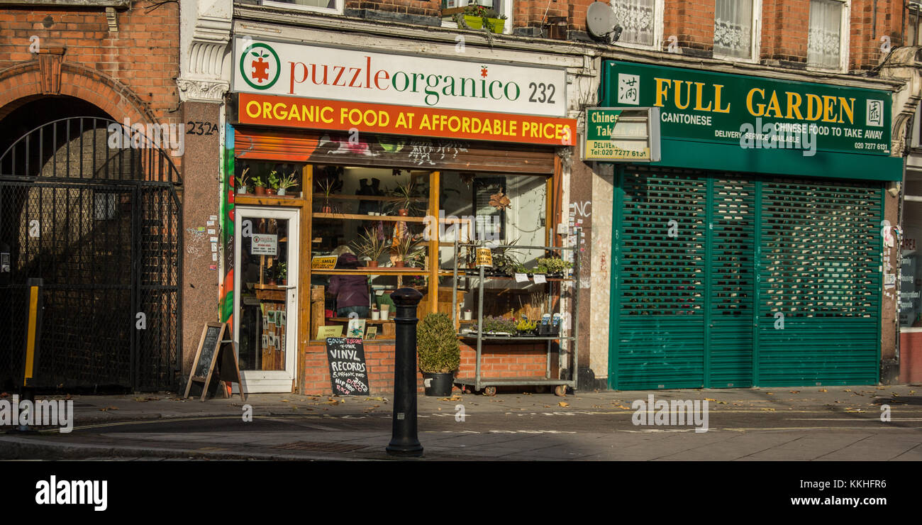 Peckham, London, UK. 1 December 2017. The Puzzle Organico health shop and the Full Garden