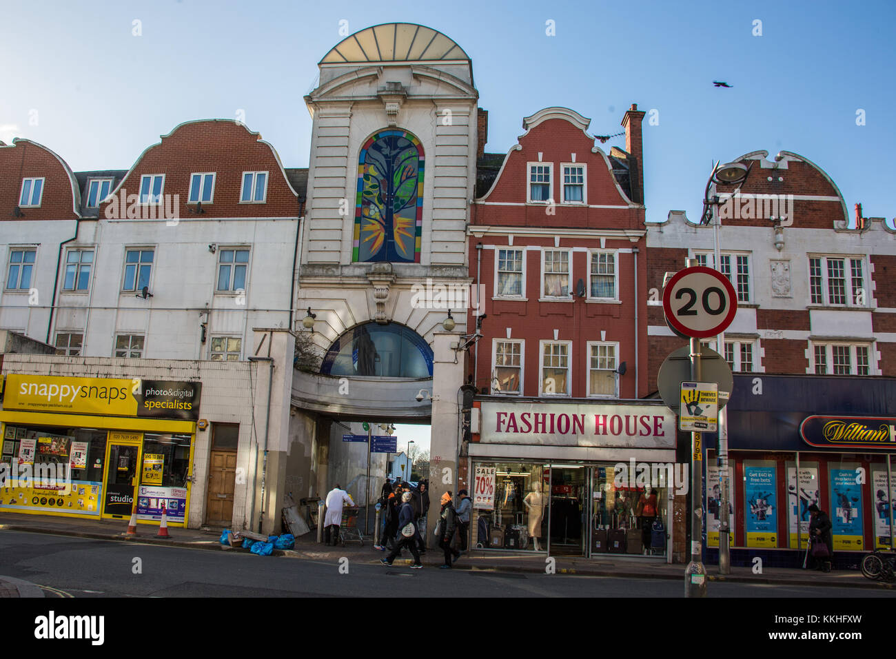 Peckham, London, UK. 1 December 2017.  The ornate pedestrian entrance to the car park   flanked by Snappy Snaps and the Fashion House on Rye Lane. David Rowe/Alamy Live News. Stock Photo
