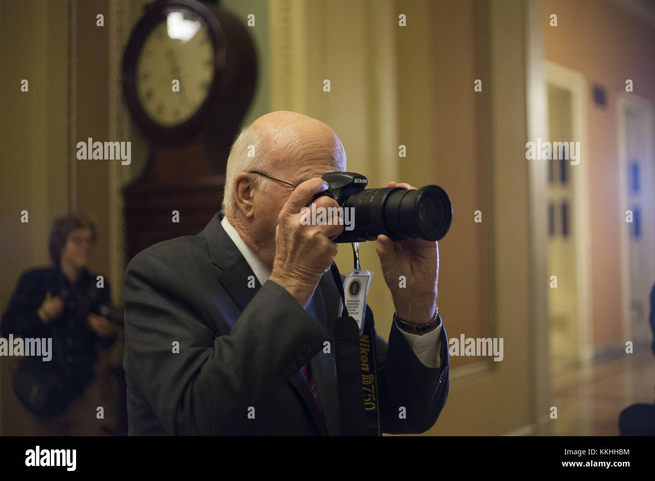 Washington, District of Columbia, USA. 1st Dec, 2017. United States Senator Patrick Leahy (Democrat of Vermont) takes pictures of photojournalists gathered near the US Senate Chamber in the US Capitol in Washington, DC on Friday, December 1, 2017. Credit: Alex Edelman/CNP Credit: Alex Edelman/CNP/ZUMA Wire/Alamy Live News Stock Photo