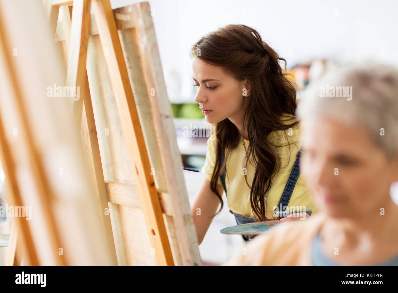 student girl with easel painting at art school Stock Photo - Alamy