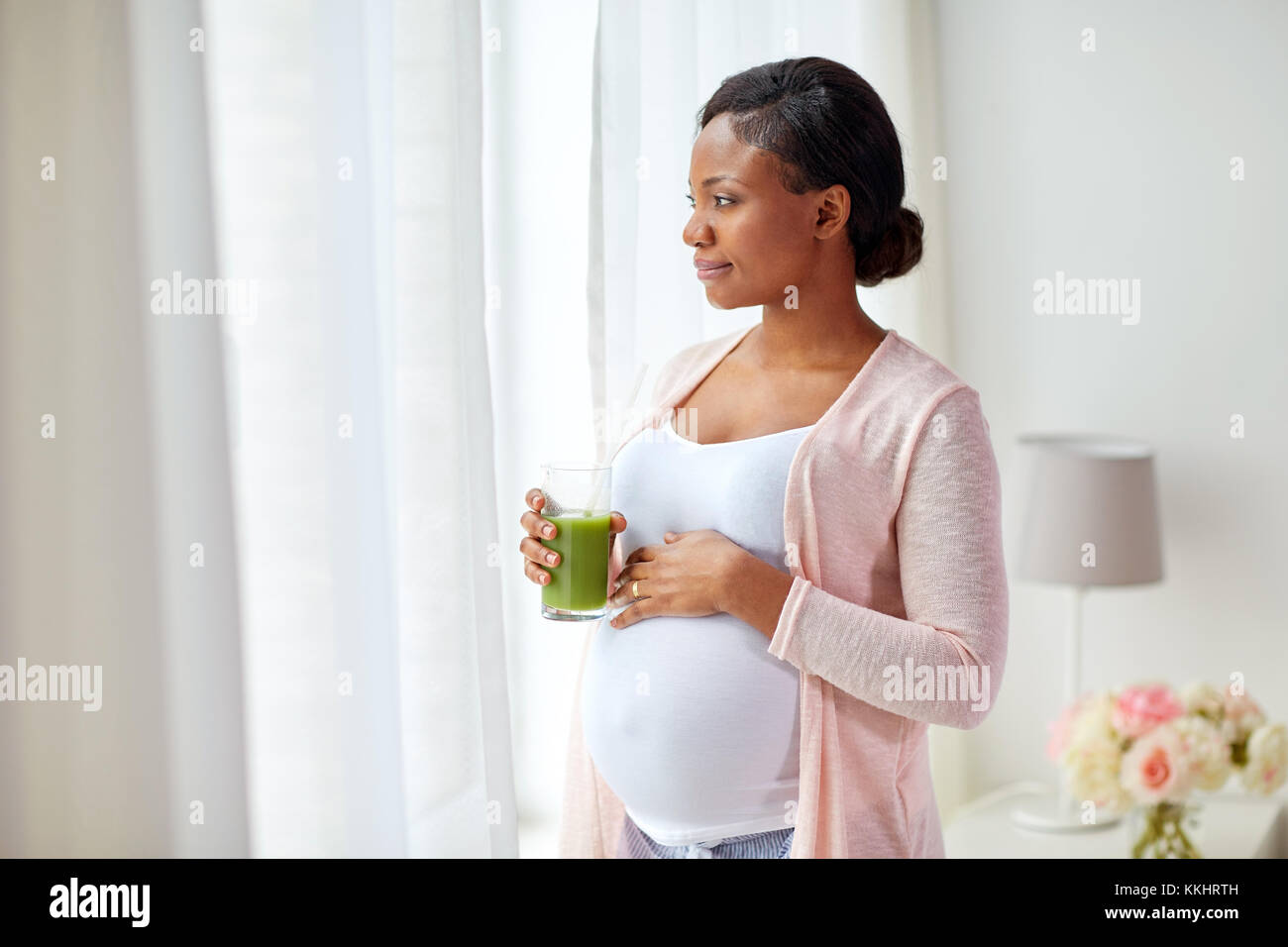 pregnant woman drinking vegetable juice at home Stock Photo Alamy