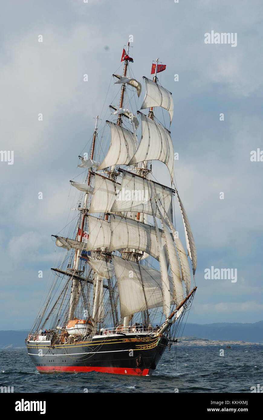 The Stad Amsterdam is a large tall ship, originally constructed in the Netherlands as a modern replica of a historic merchant vessel, known for its elegant design and sailing capabilities. Stock Photo