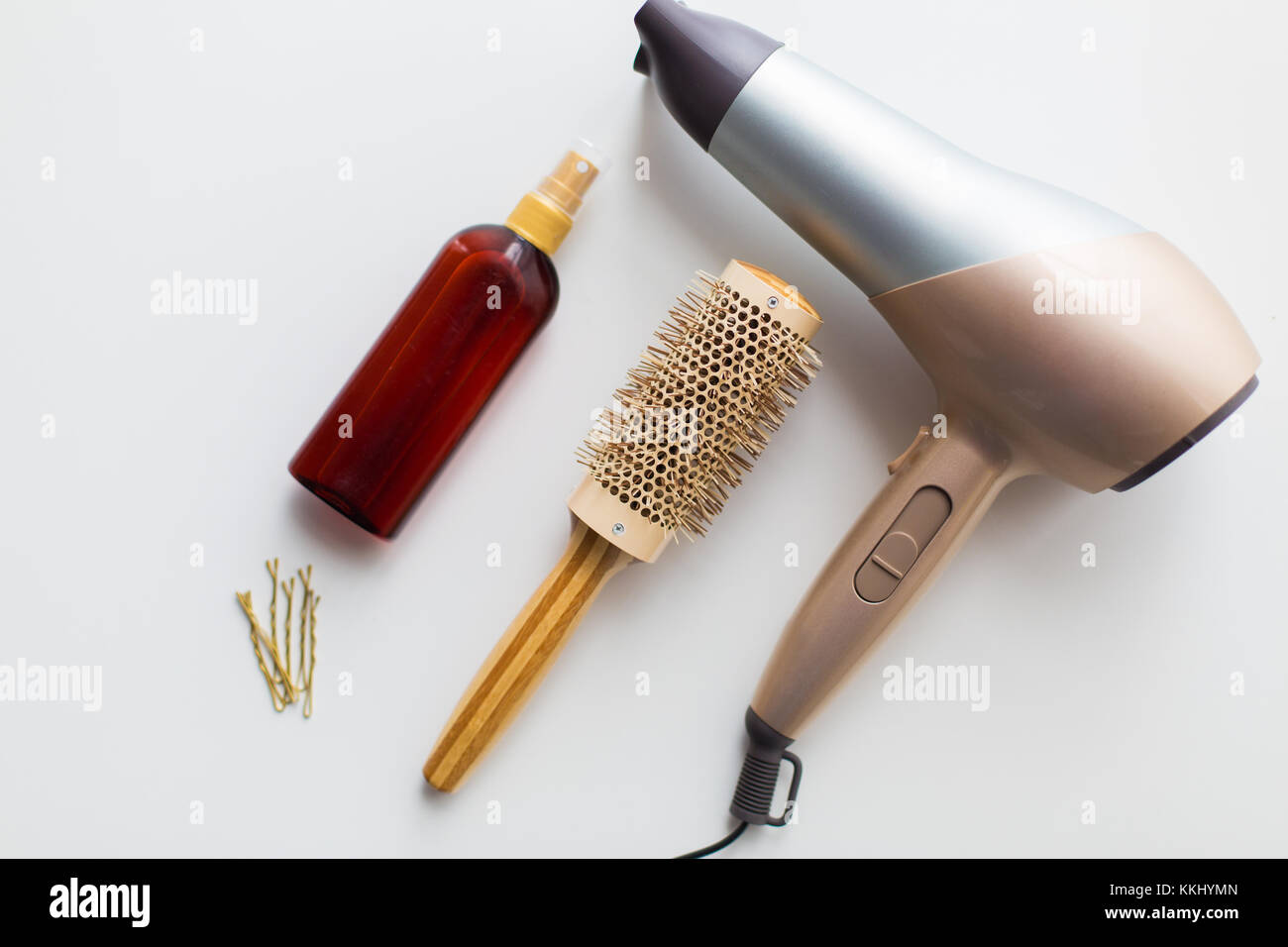 hairdryer, brush, hot styling hair spray and pins Stock Photo Alamy