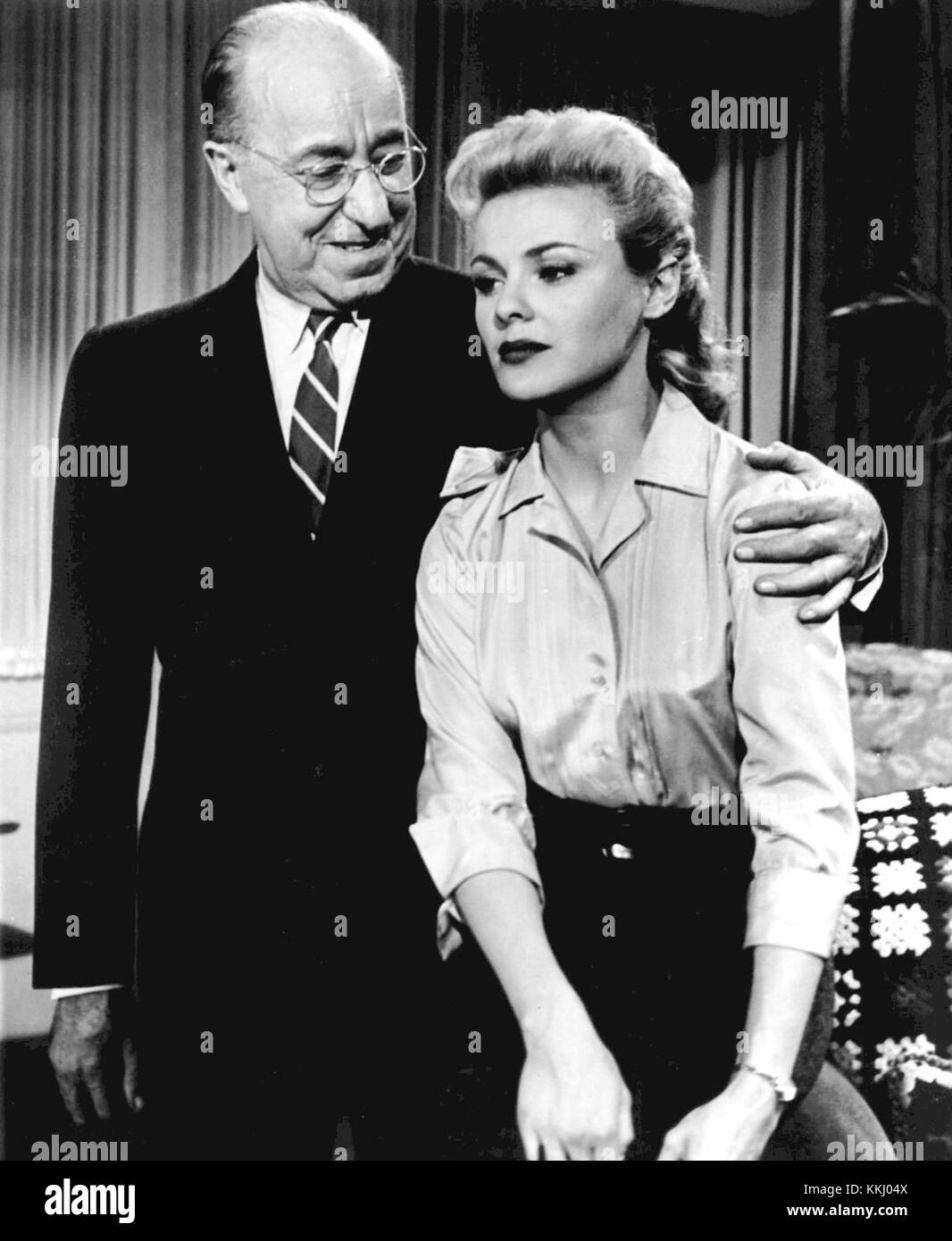 The Great American Hoax, a film featuring Ed Wynn and Kathleen Crowley, presents a comedic narrative that highlights social themes. The film is known for its performances and offers a critique of American society through satire. Stock Photo