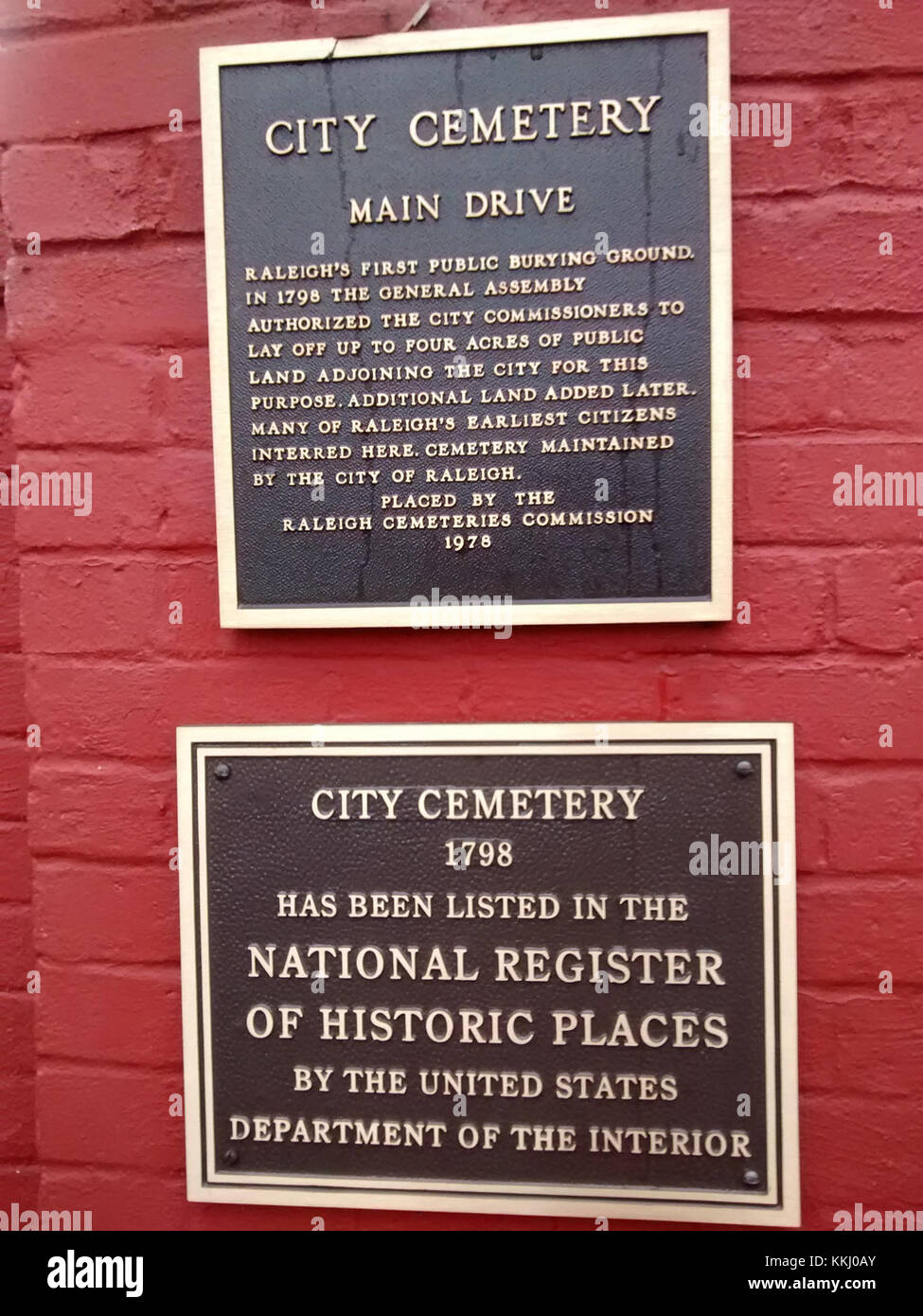 The plaque at Raleigh City Cemetery commemorates historical figures and ...