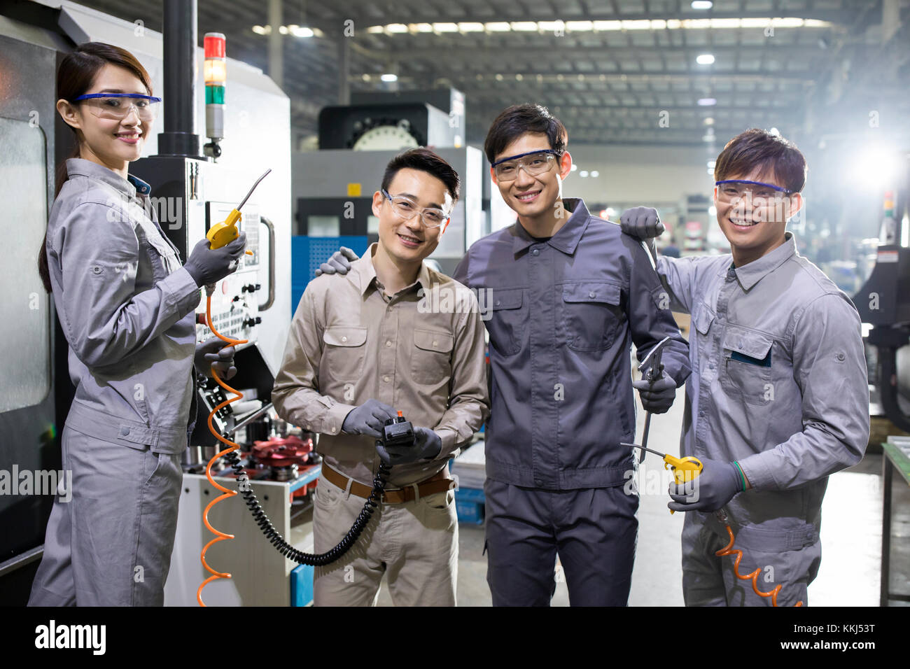 Confident Chinese engineers in the factory Stock Photo Alamy
