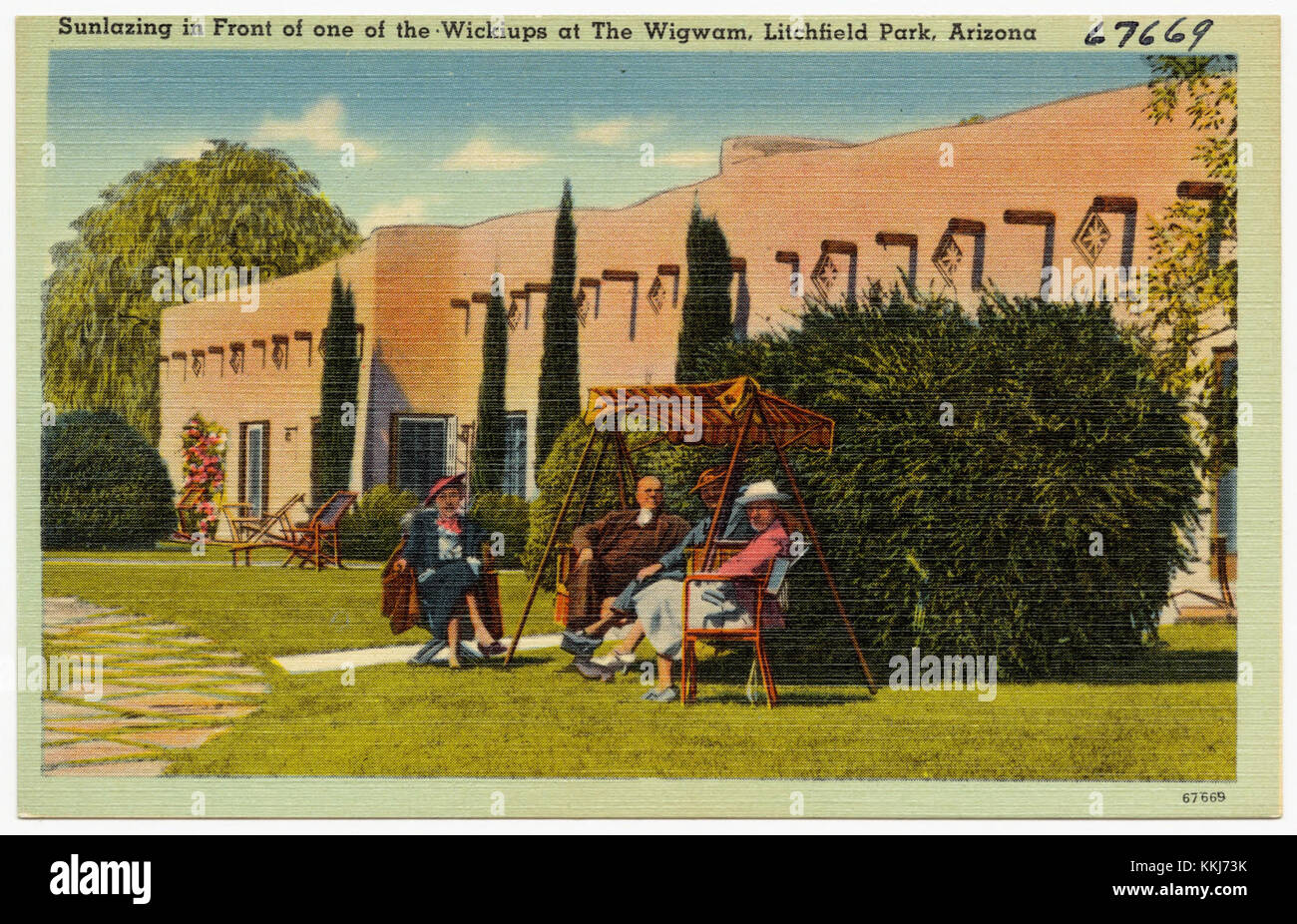 The image captures individuals relaxing in front of a wickiup, a traditional Native American shelter, at The Wigwam in Litchfield Park, Arizona. This area is known for its cultural and historical significance, with the Wigwam offering a glimpse into Native American architecture and lifestyle. Stock Photo