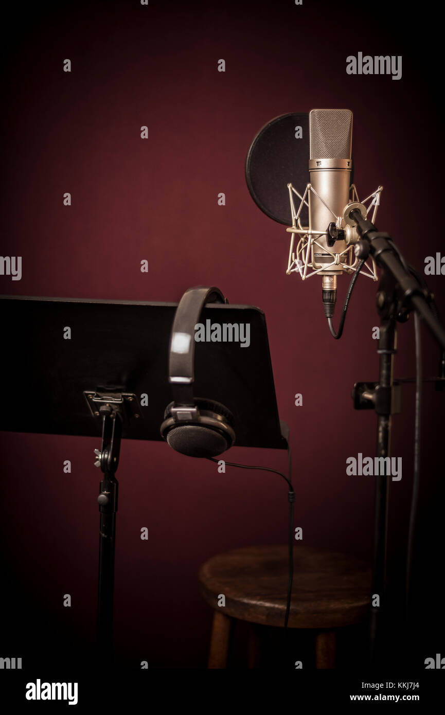 Voice recording studio set up, with microphone, music stand and headphones,  vertical Stock Photo - Alamy