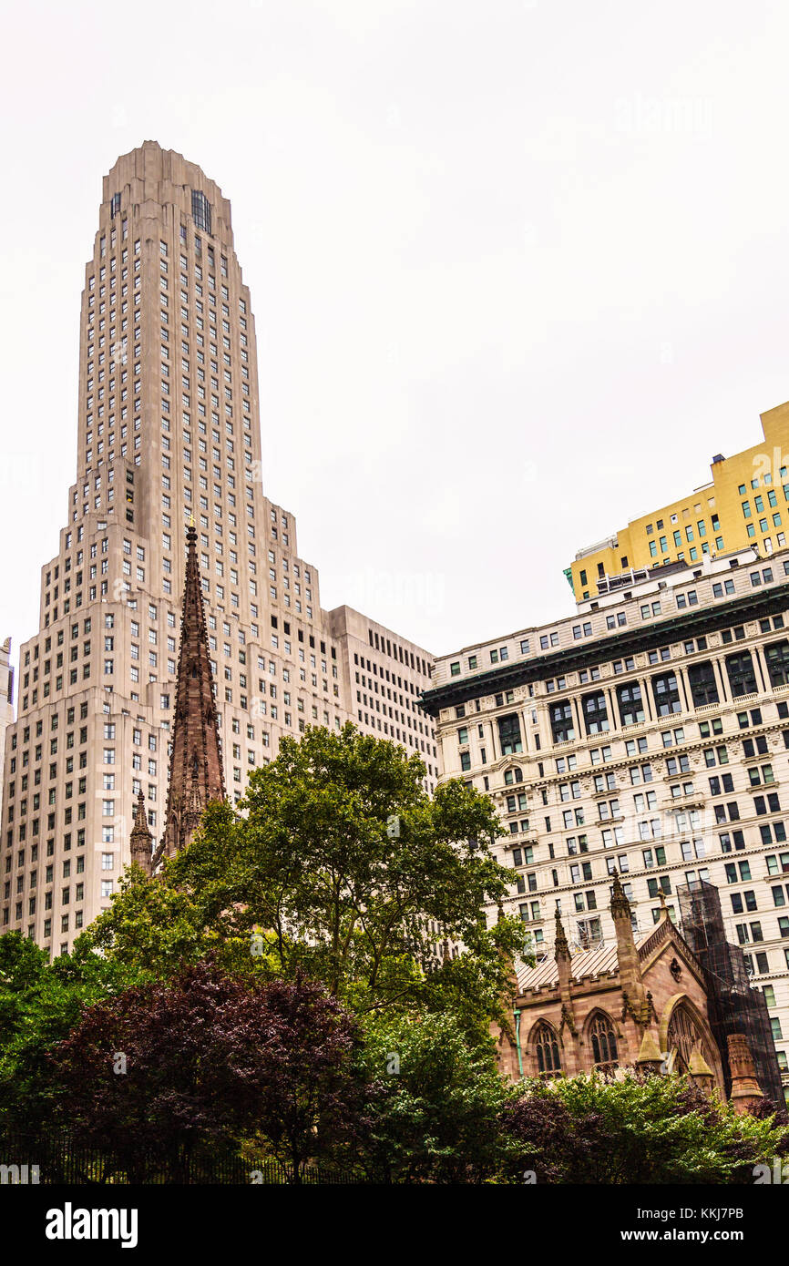Street view on Trinity Church and surrounding skyscrappers, Lower Manhattan, New York City, USA Stock Photo