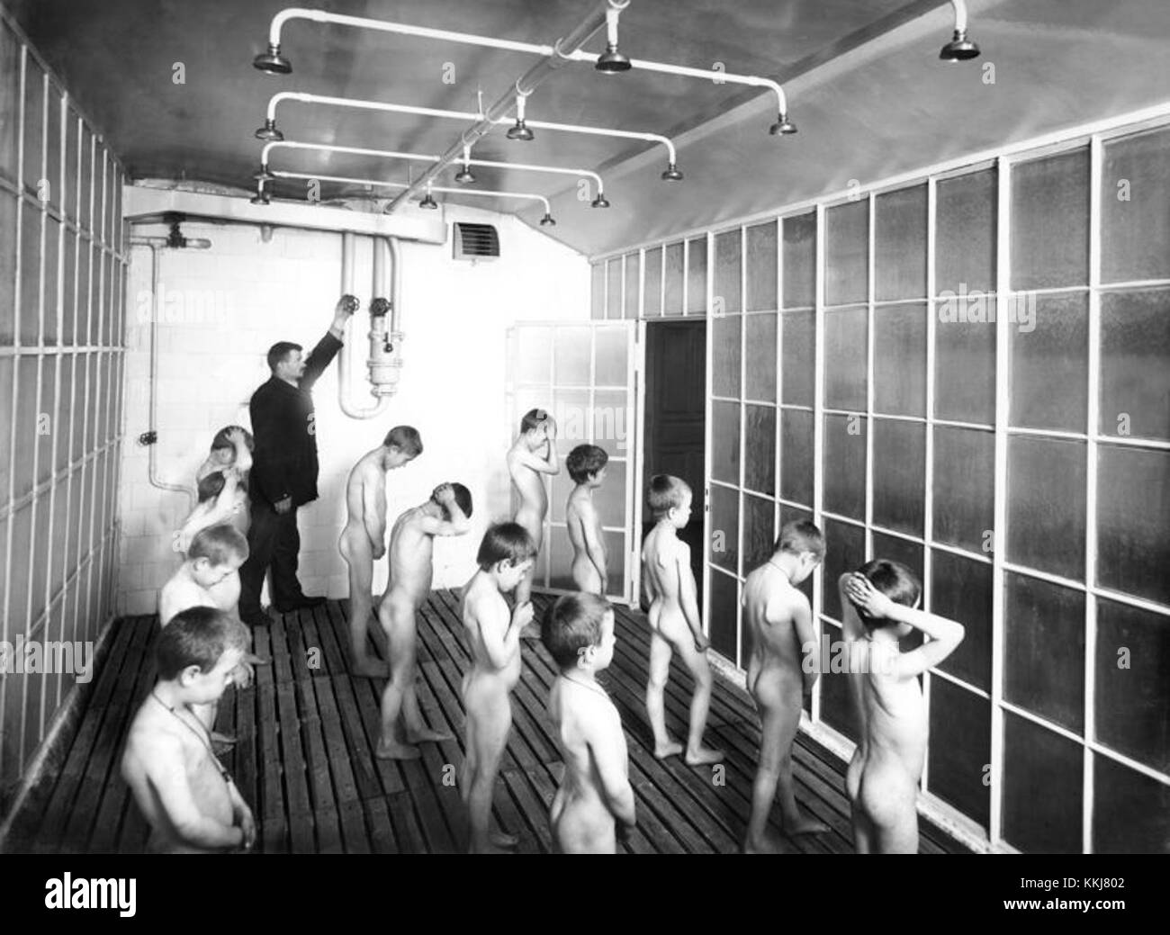 public shower boys Communal shower Black and White Stock Photos & Images - Alamy