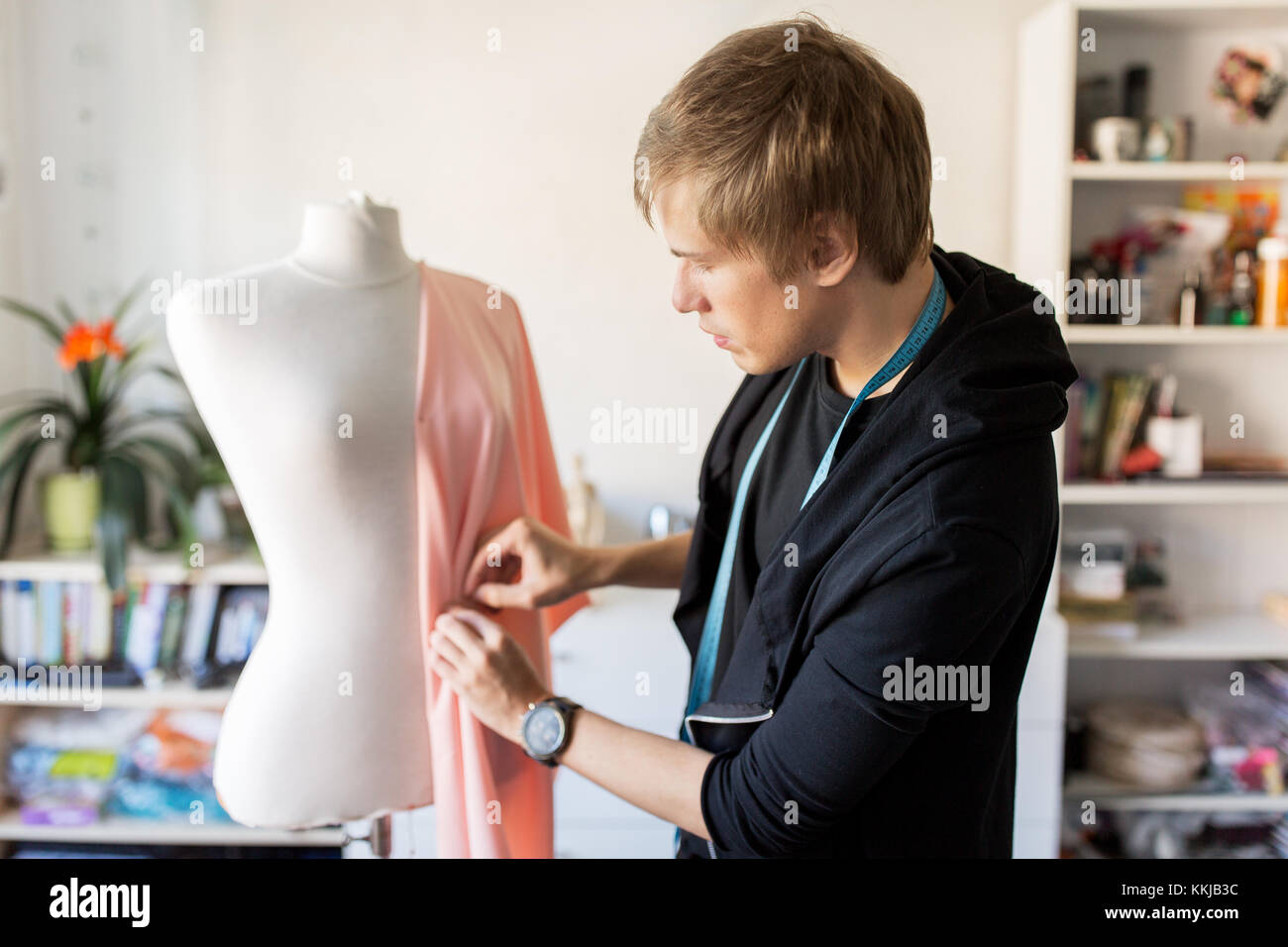 fashion designer with dummy making dress at studio Stock Photo Alamy