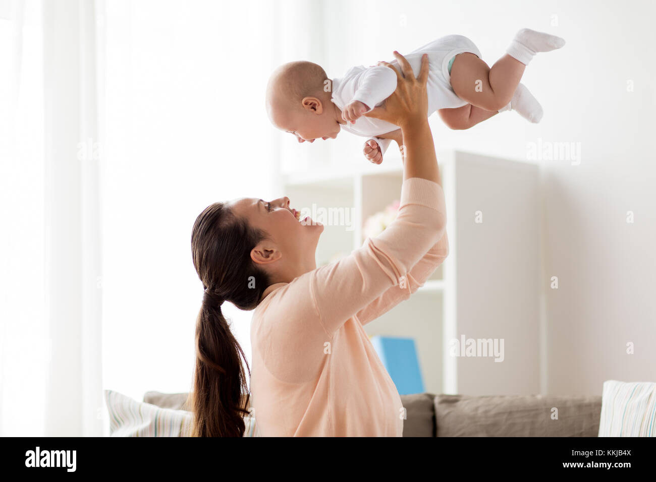 happy mother playing with little baby boy at home Stock Photo - Alamy