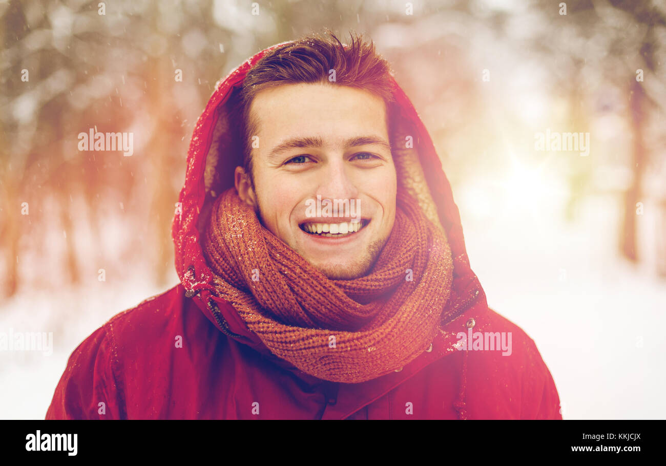 happy man in winter jacket with hood outdoors Stock Photo - Alamy