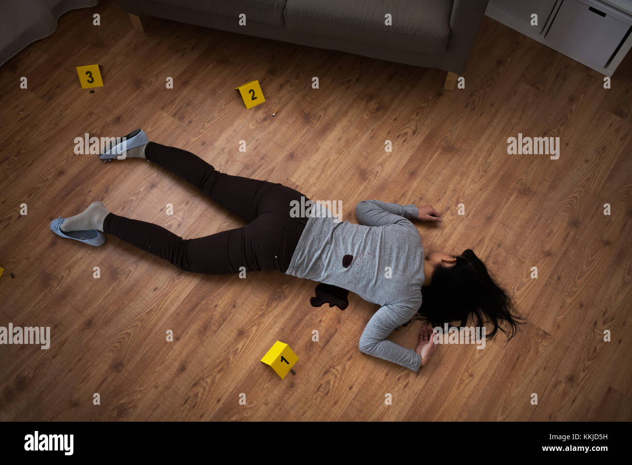 dead woman body in blood on floor at crime scene Stock Photo