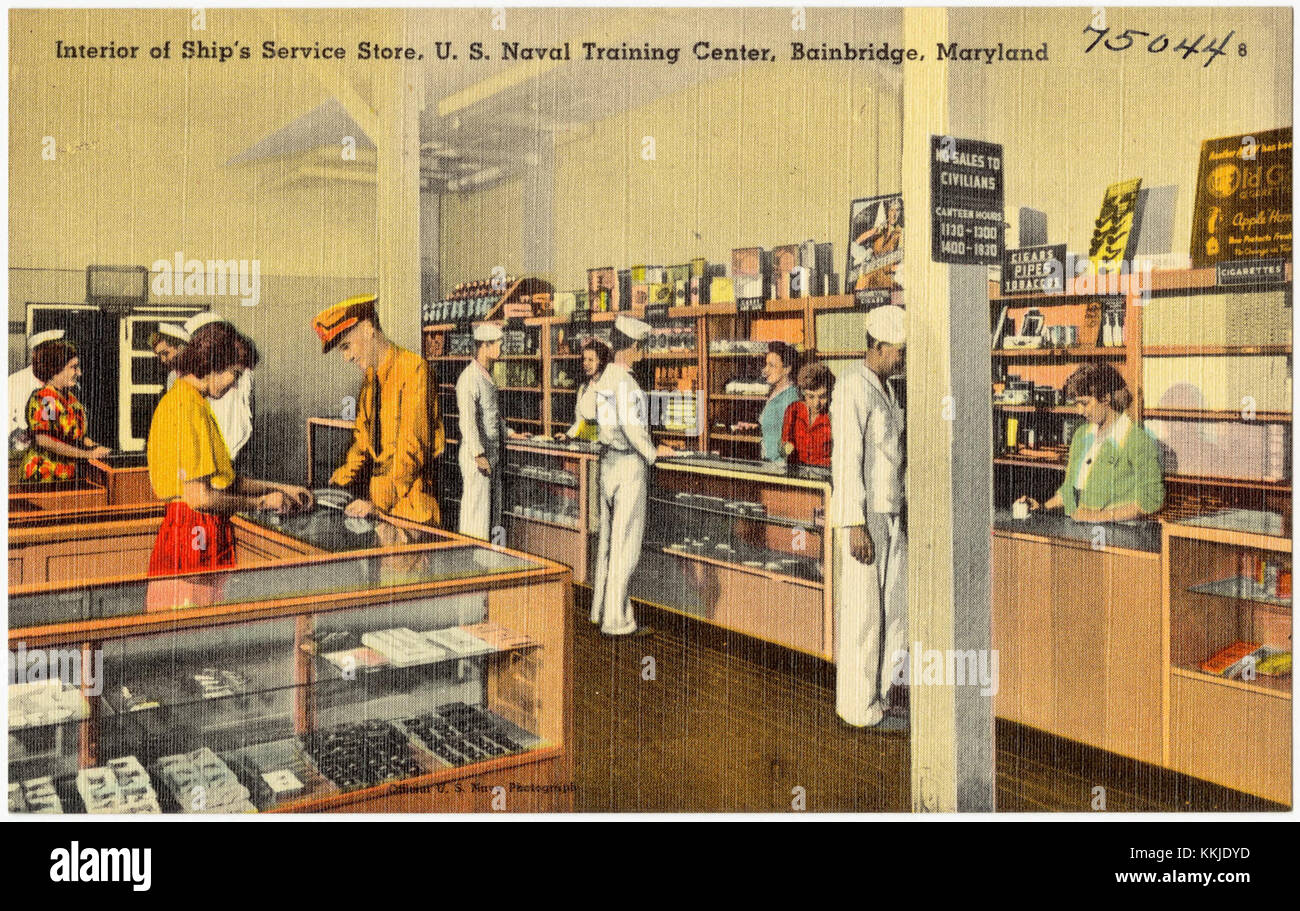 This photograph depicts the interior of the Ship's Service Store at the ...