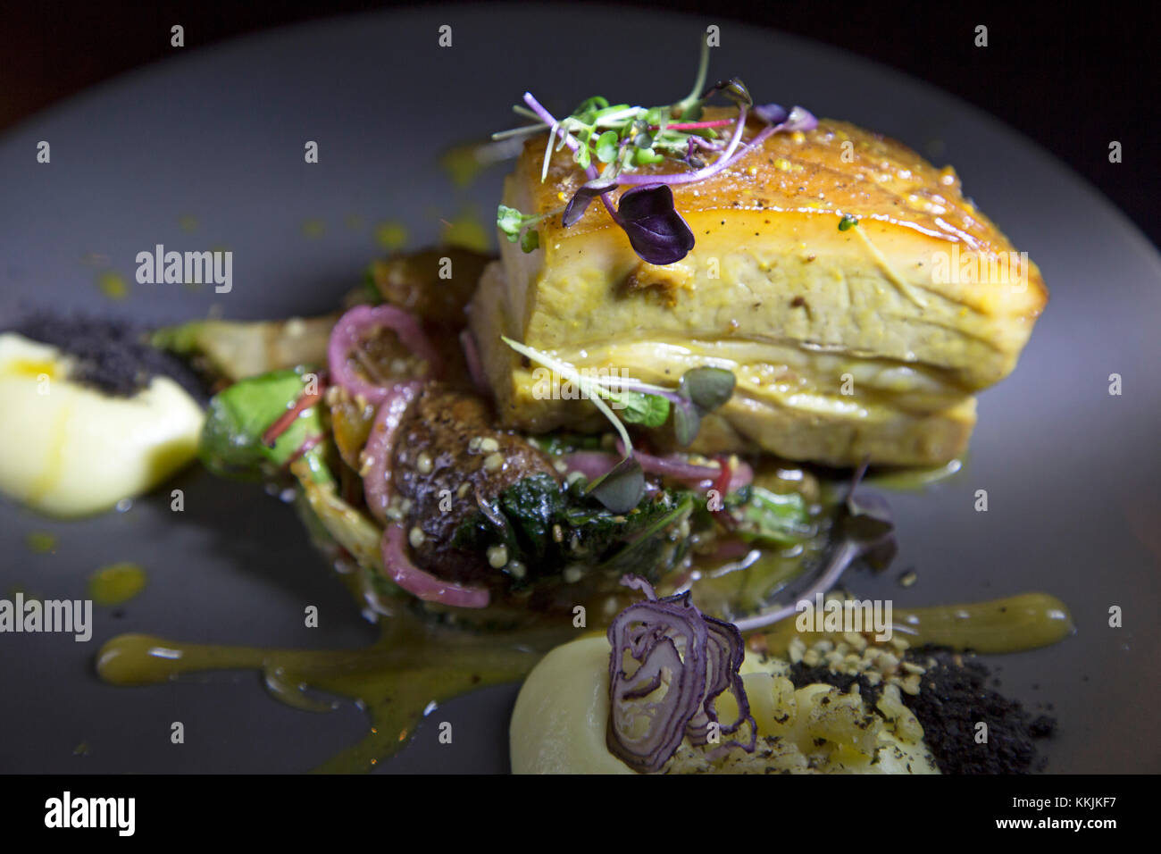 Slowcooked pork belly served with seasonal vegetables at the Mute