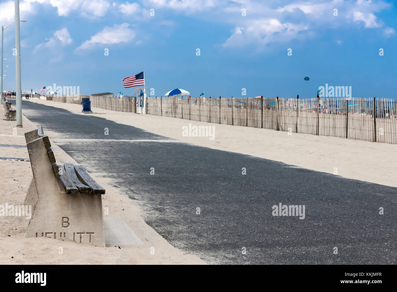 Wooden bench along Manasquan's beach front walkway in New Jersey. Stock Photo