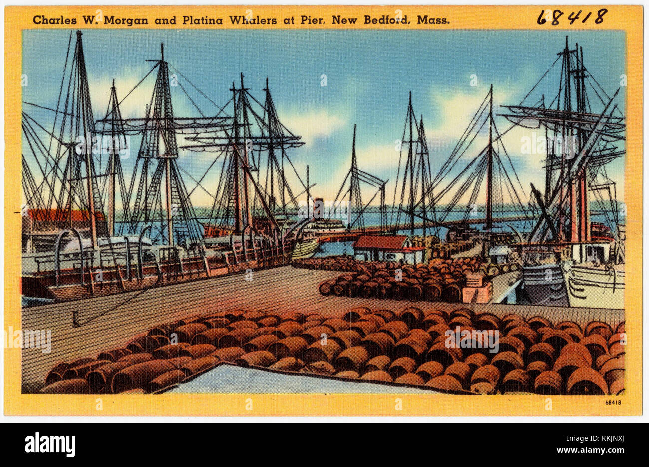 The image features the Charles W. Morgan whaling ship and Platina whalers docked at the pier in New Bedford, Massachusetts. This historical scene captures the whaling industry's importance in the region's maritime history. Stock Photo