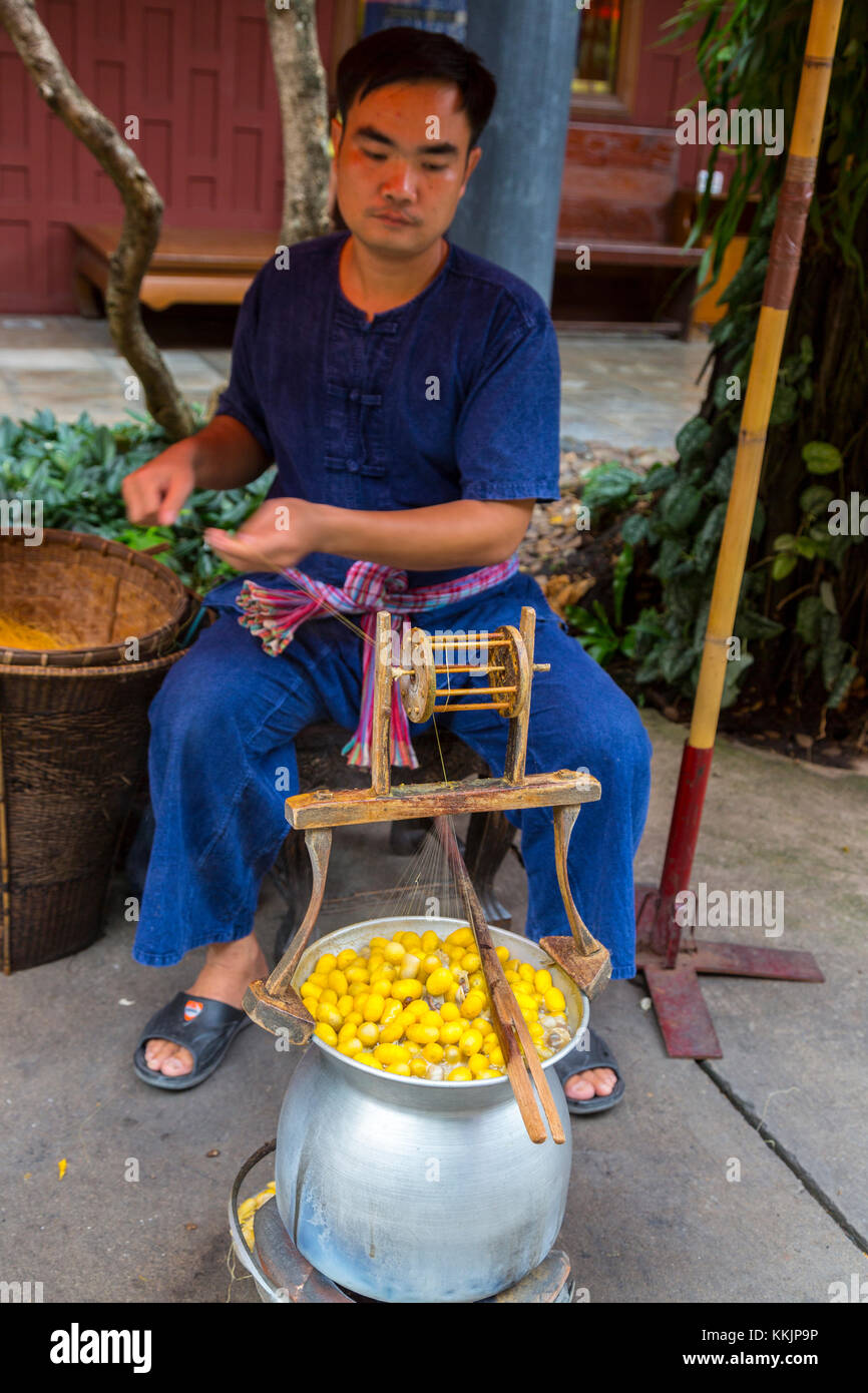 Bangkok, Thailand.  Boiling Raw Silk Cocoons, Jim Thompson House Demonstration. Stock Photo