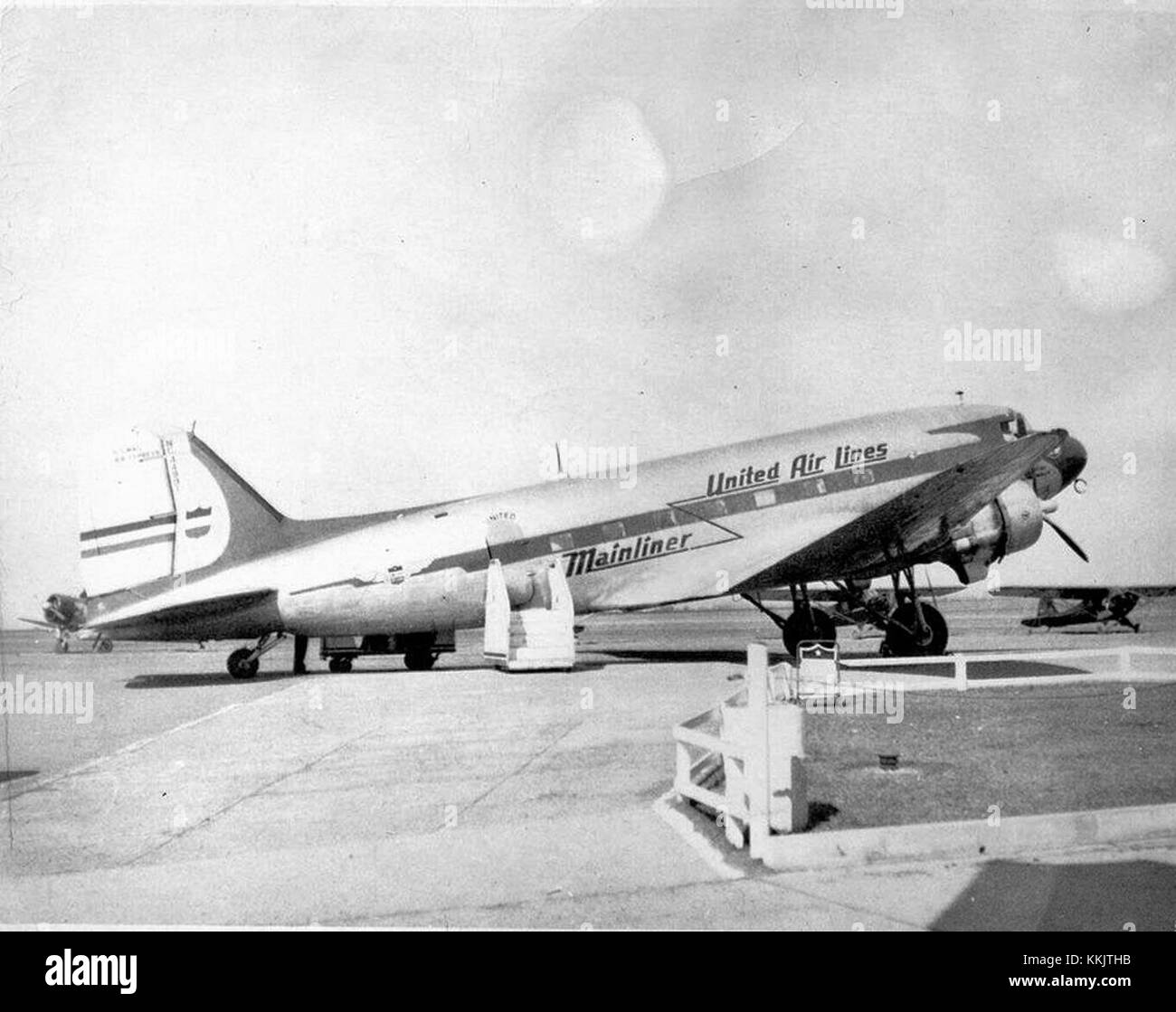 A photograph from 1942 depicting a United Air Lines Mainliner at ABE Airport, showcasing the aviation industry during World War II. Stock Photo
