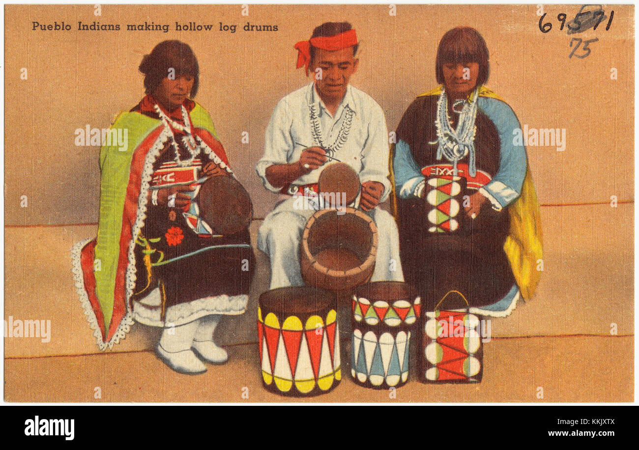 Pueblo Indians making hollow log drums Stock Photo