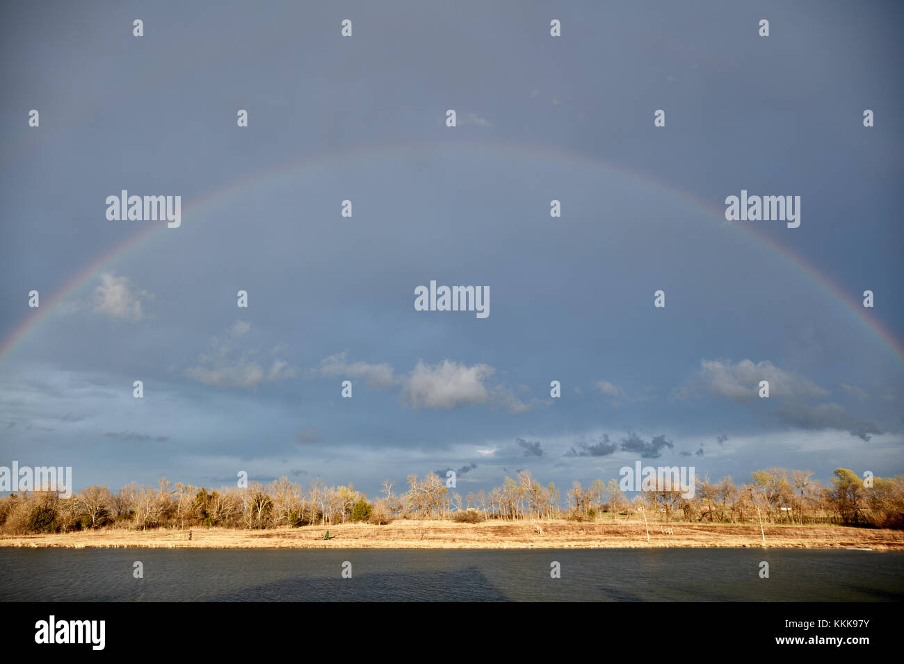 Rainbow against dark clouds hi-res stock photography and images - Alamy