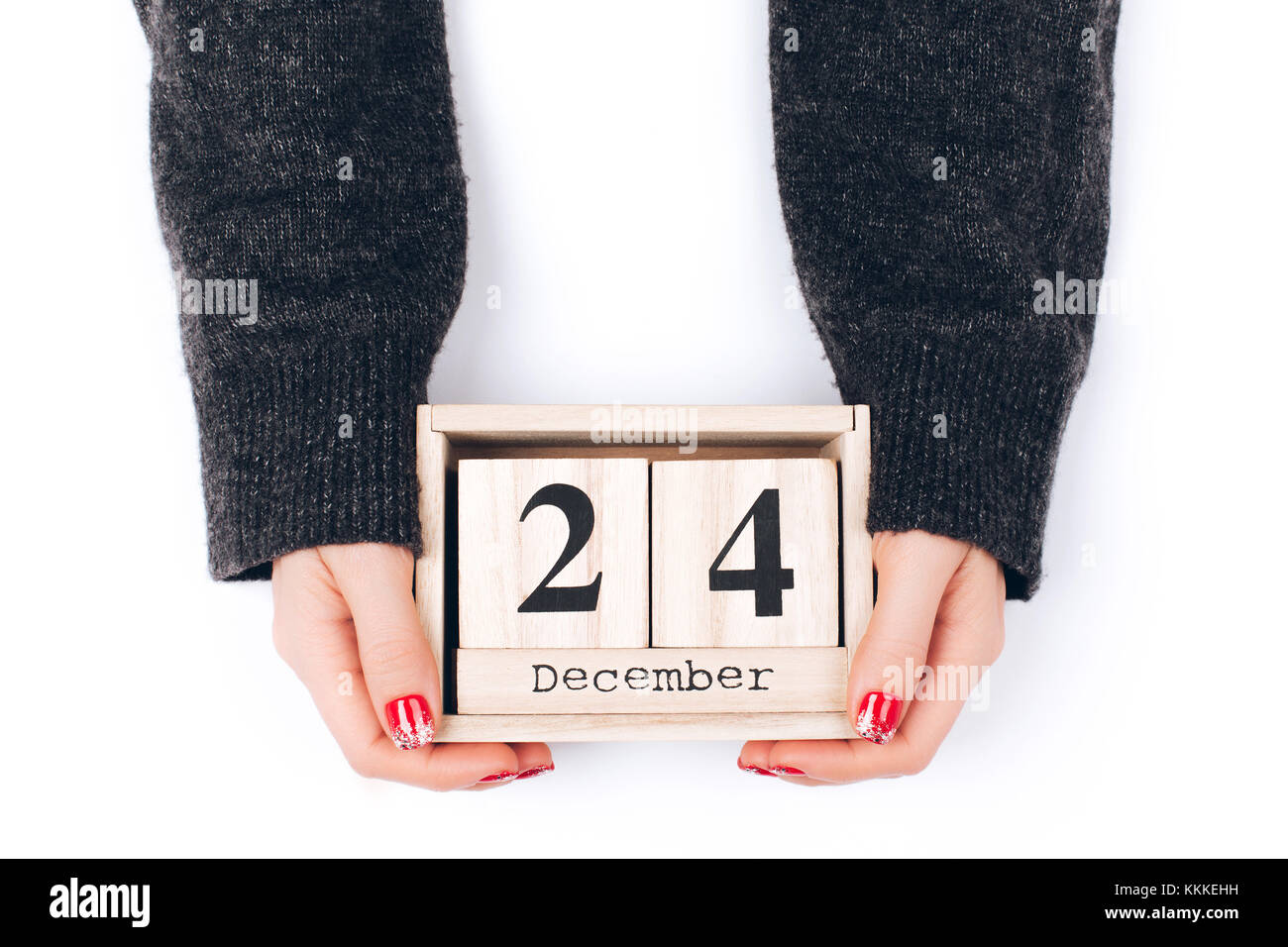 Hands with Christmas Eve date Stock Photo Alamy