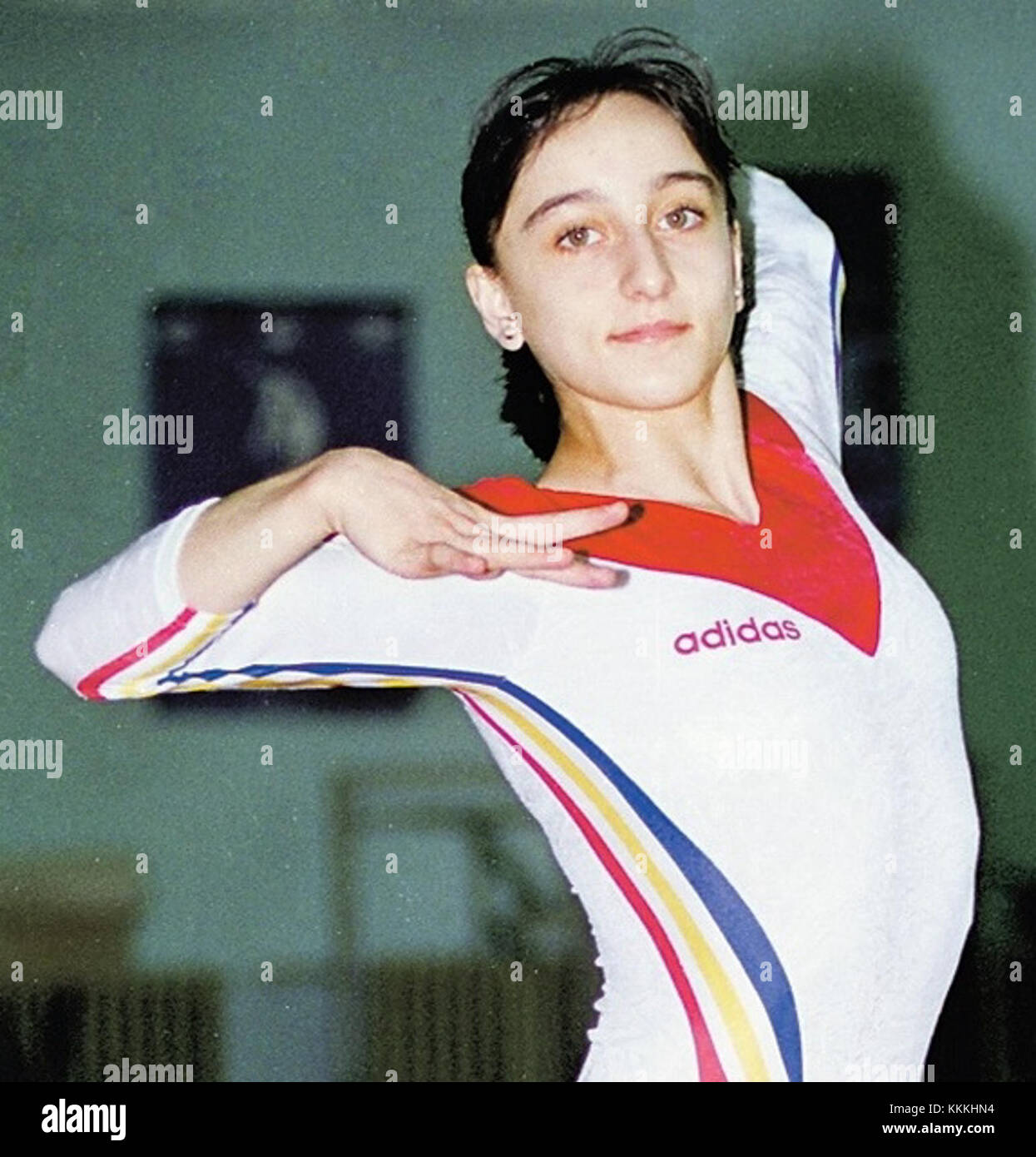 This image features Gina Gogean, a former Romanian gymnast. Gogean is ...