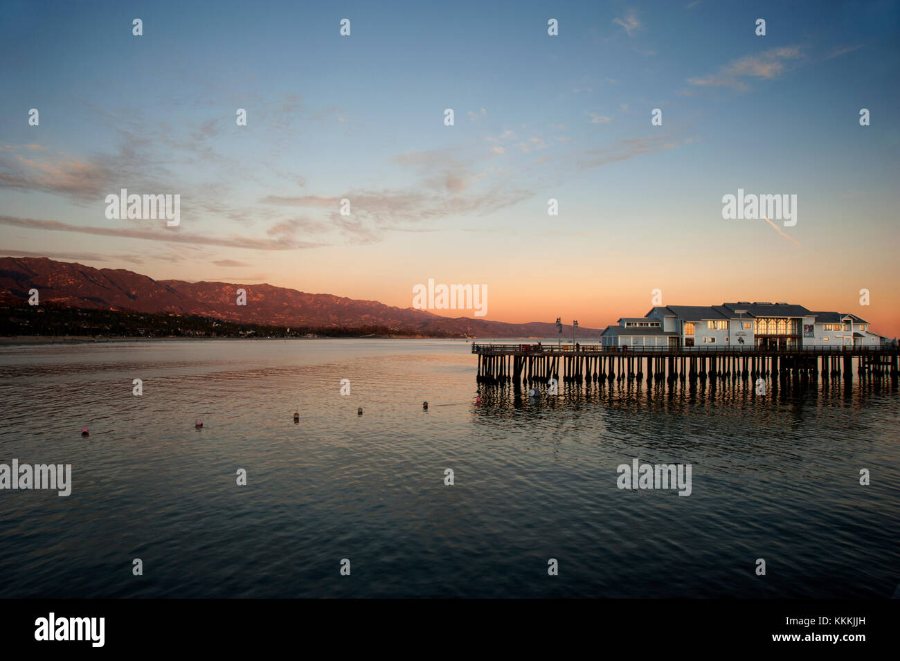 View of southern California coast with Santa Barbara pier at sunset. Stock Photo