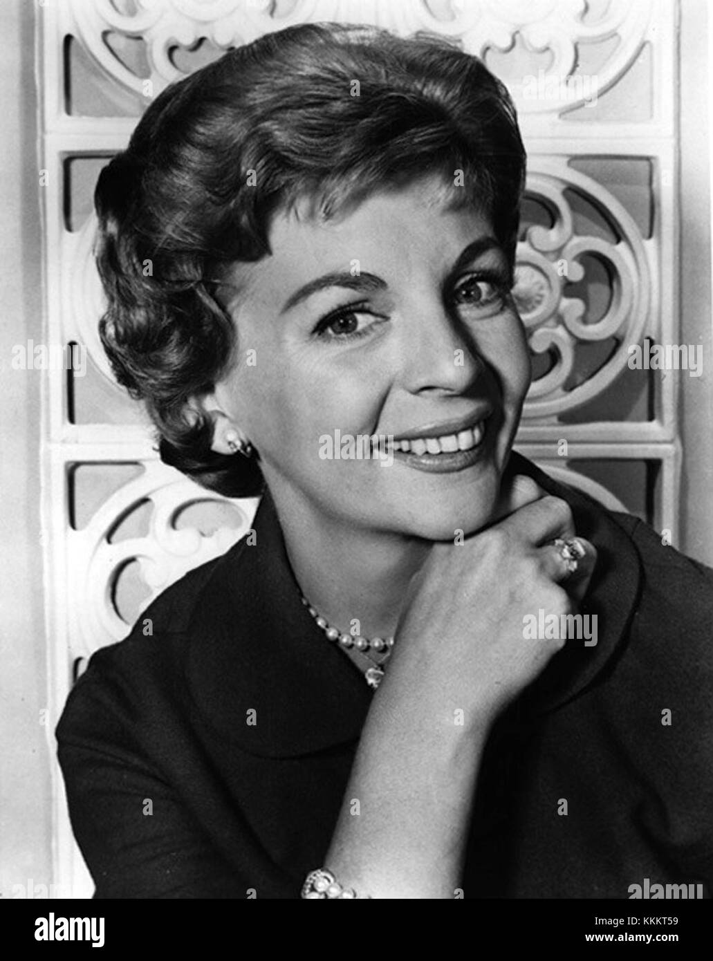 This promotional still features Dorothy Collins, an iconic figure in entertainment. The image captures her in a moment of performance, representing her work in the field of music, television, or theater. Stock Photo