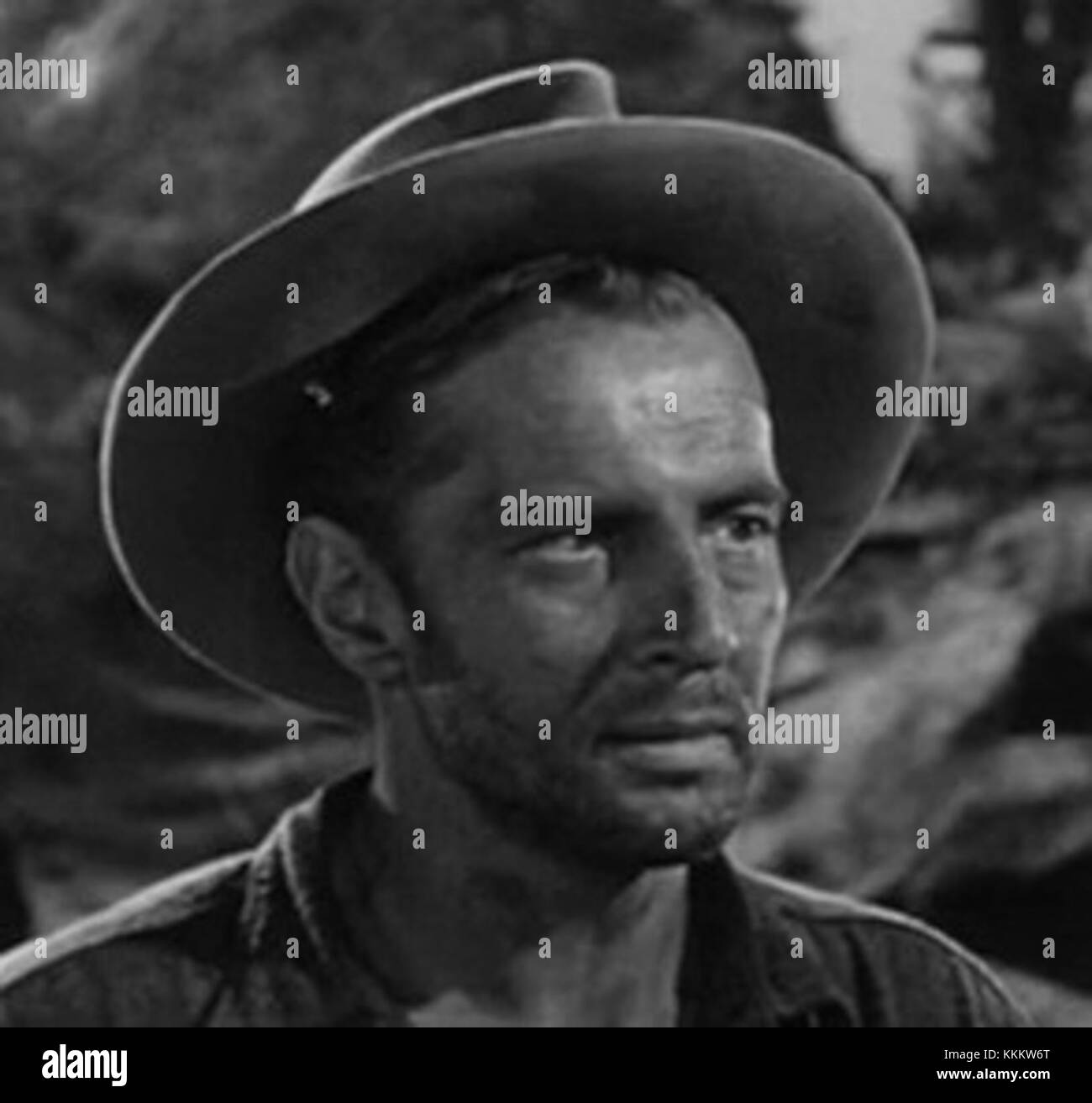 Bruce Bennett appears in a scene from the trailer for *The Treasure of the Sierra Madre*, contributing to the film's iconic portrayal of greed and survival. Stock Photo