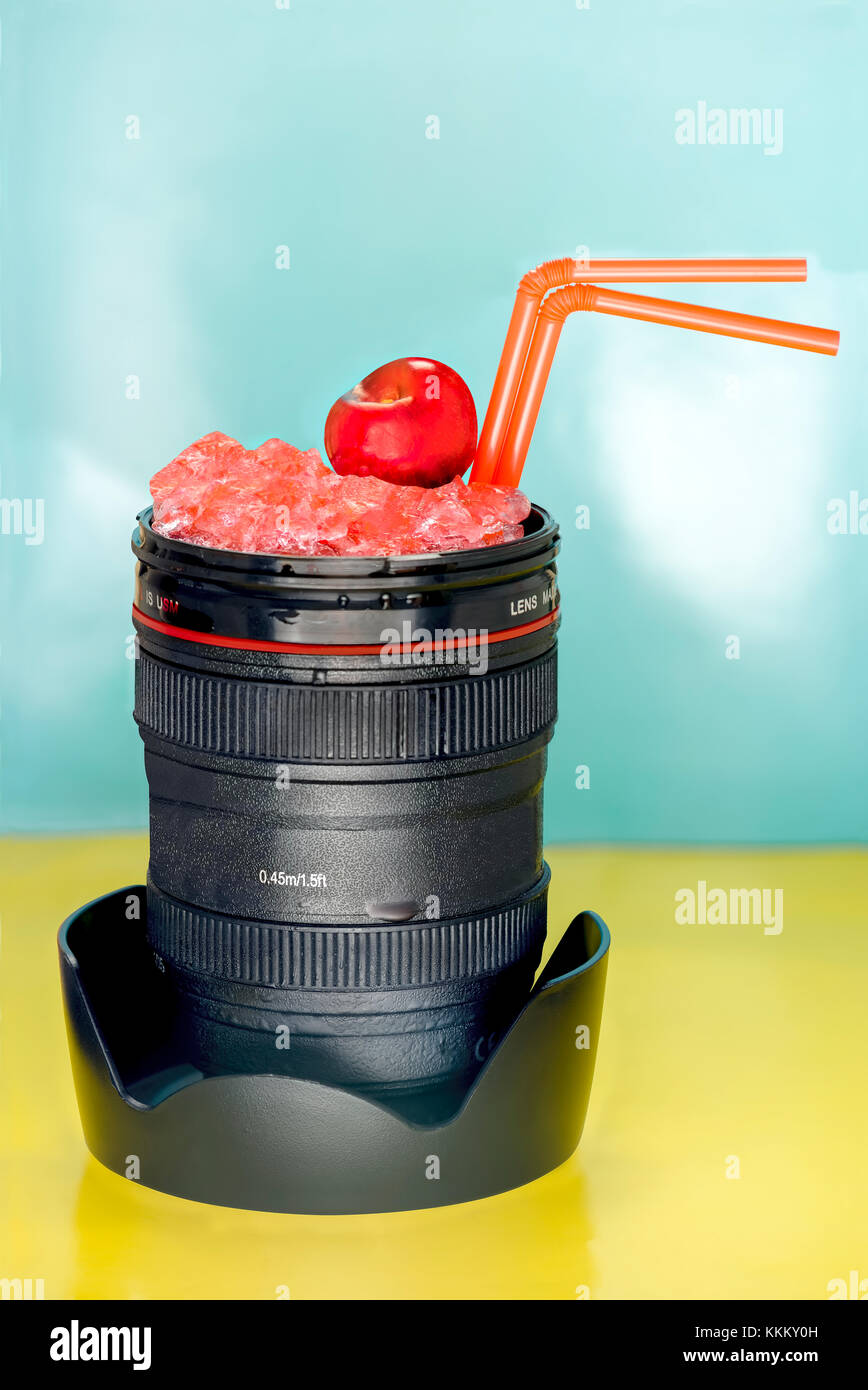 photographic lens with red drink with two straws Stock Photo