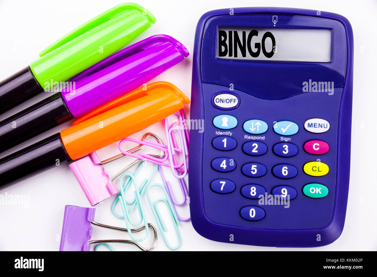 Writing word Bingo text in the office with surroundings such as marker, pen writing on calculator. Business concept for Lettering Gambling to Win Pric Stock Photo