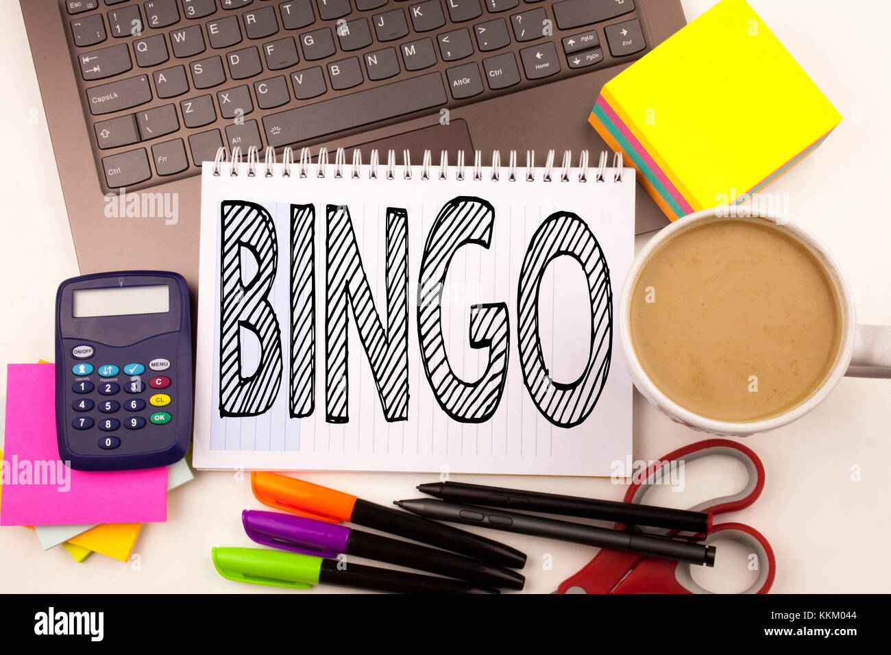 Word writing Bingo in the office with laptop, marker, pen, stationery, coffee. Business concept for Lettering Gambling to Win Price Success Workshop w Stock Photo