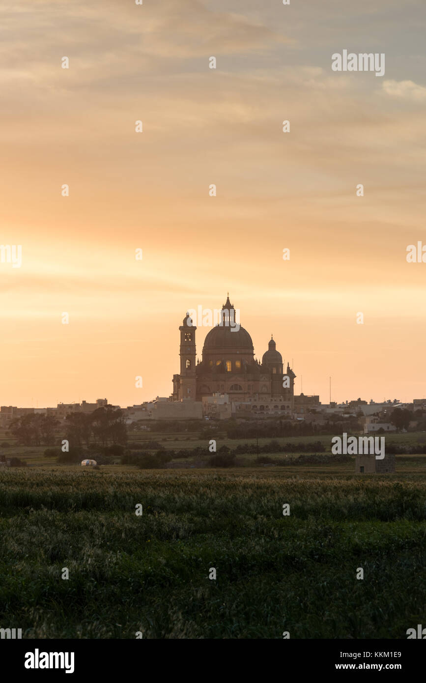 Sunset behind St George's Basilica creating a silhouette , Victoria Gozo Malta Europe Stock Photo