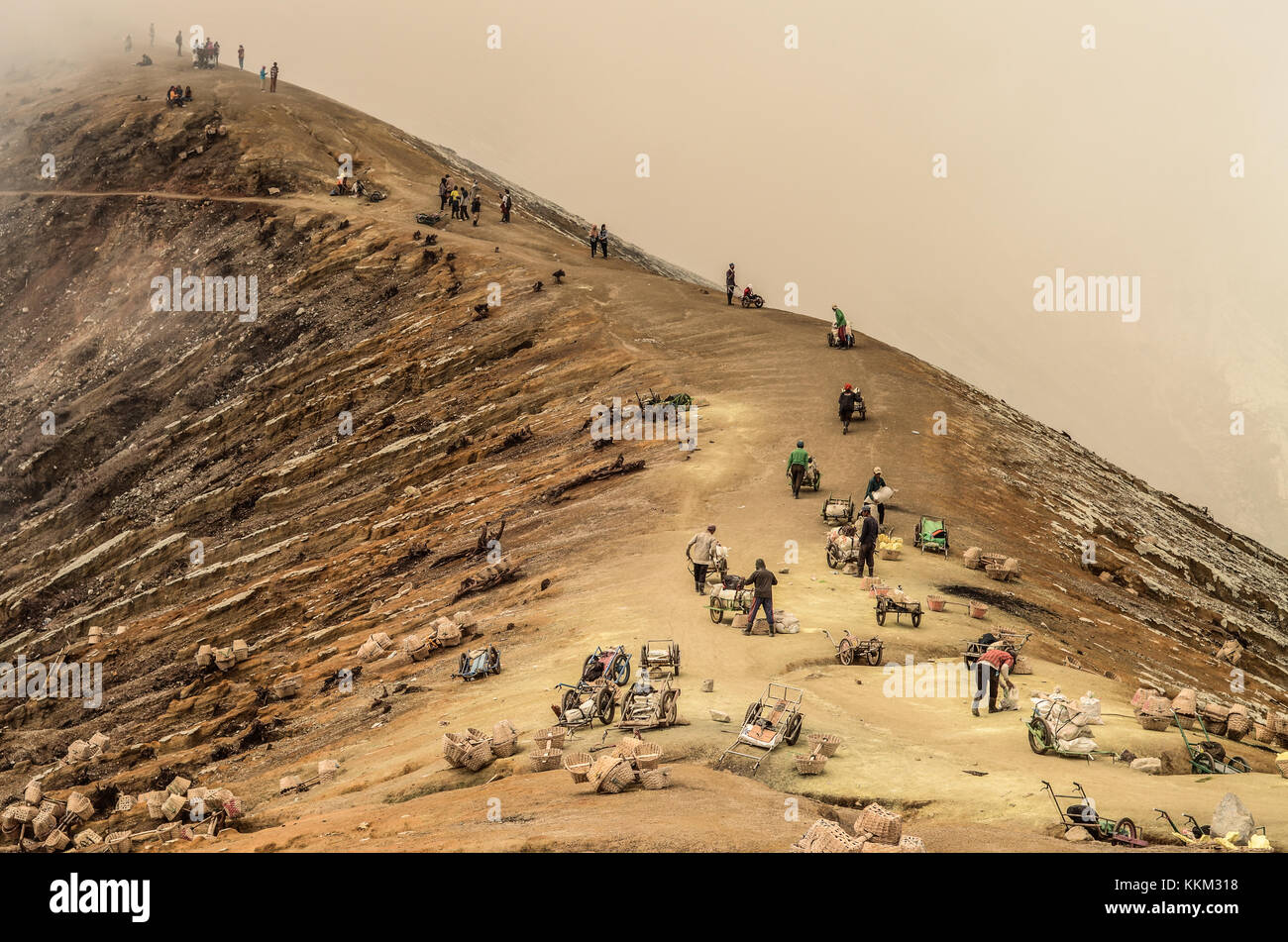 The sulfur mine in Kawah Ijen near Banyuwangi, East Java - Indonesia. The miner use wheel cart to transport the sulfur from mountain top to bottom. Stock Photo
