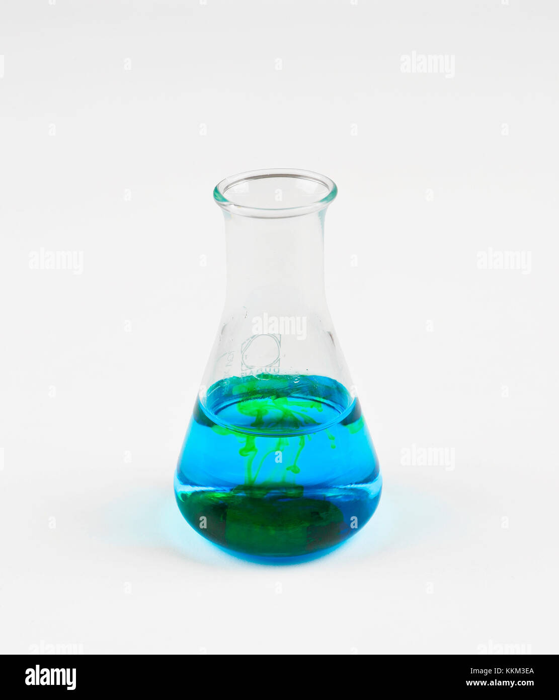 Flask with blue liquid and white background Stock Photo