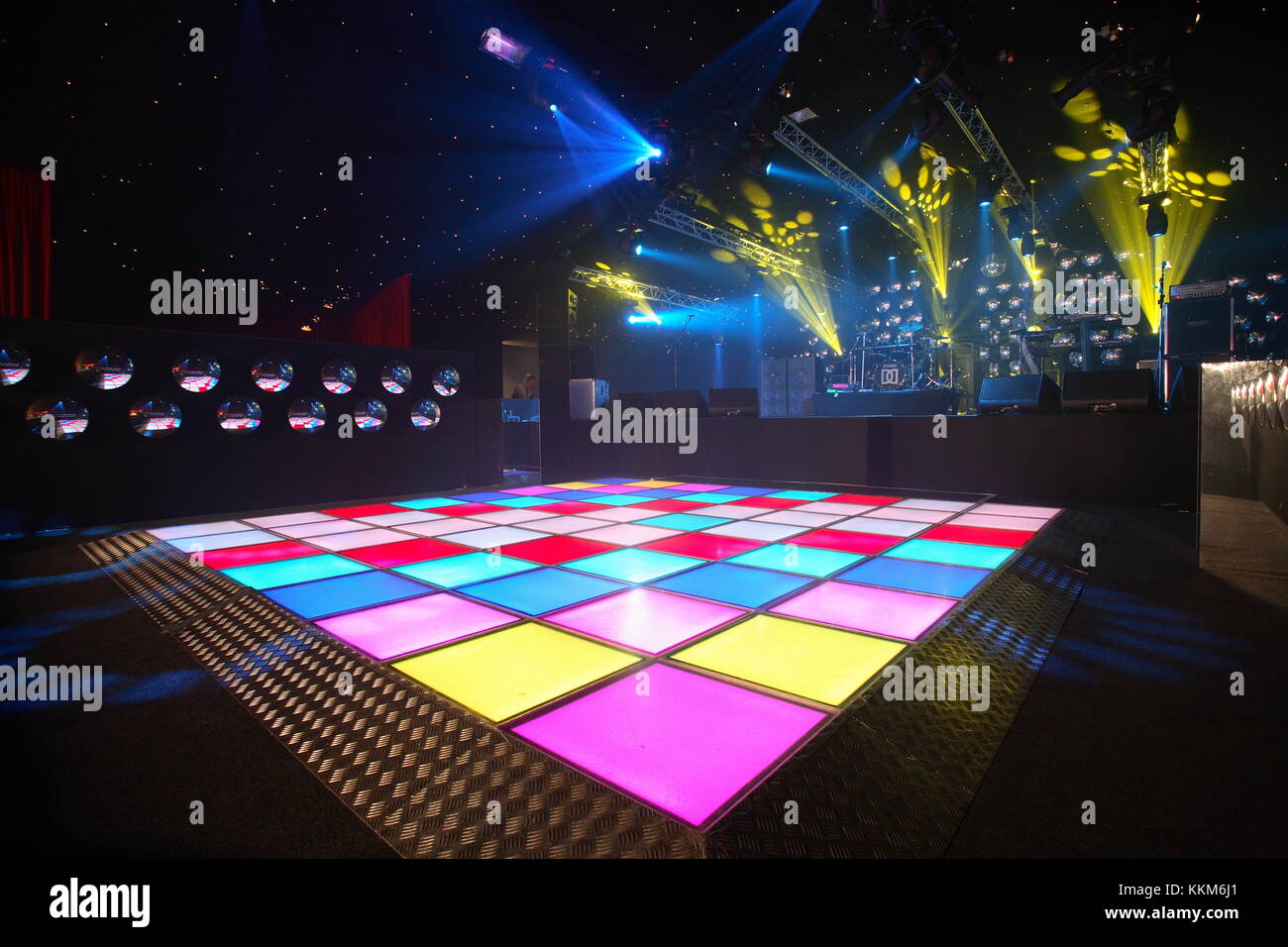 An empty dance floor with illuminated disco squares. ready for a dance