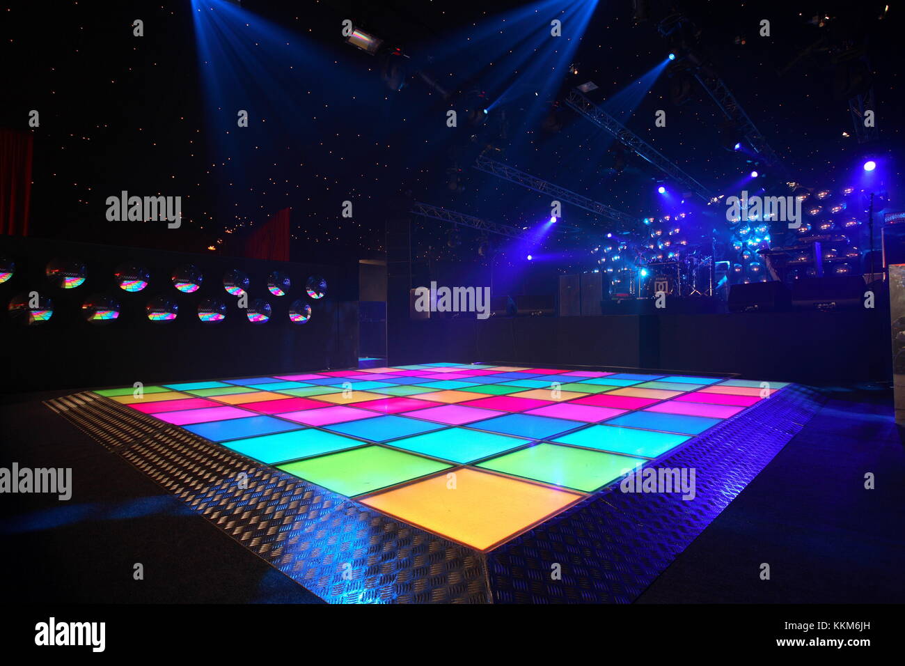 An empty dance floor with illuminated disco squares.  ready for a dance party and celebration.  Seventies kitsch style. Event Stock Photo