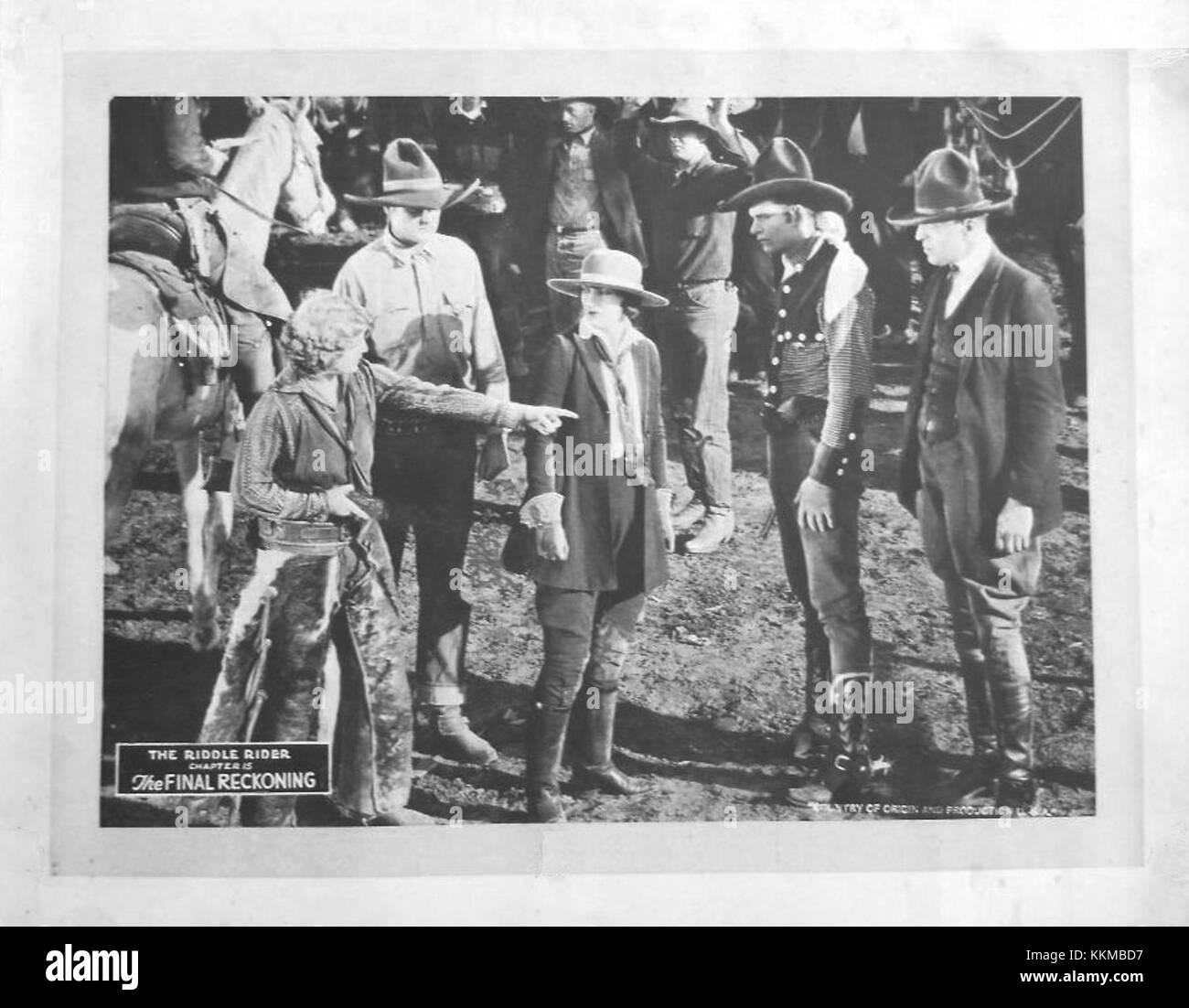 This lobby card represents a promotional image from the film 'Riddle ...