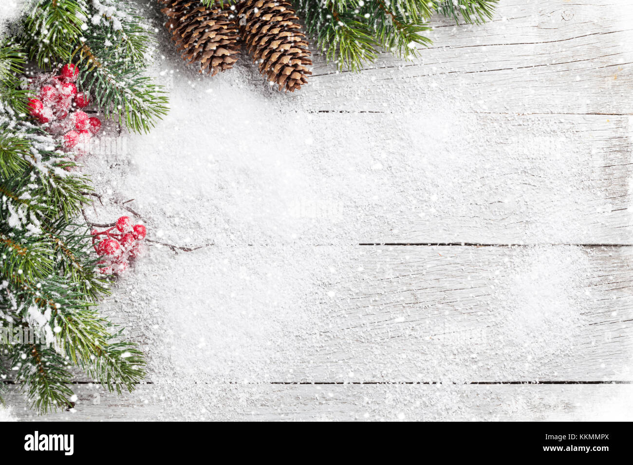 Christmas background with snow fir tree on wooden table. Top view with ...