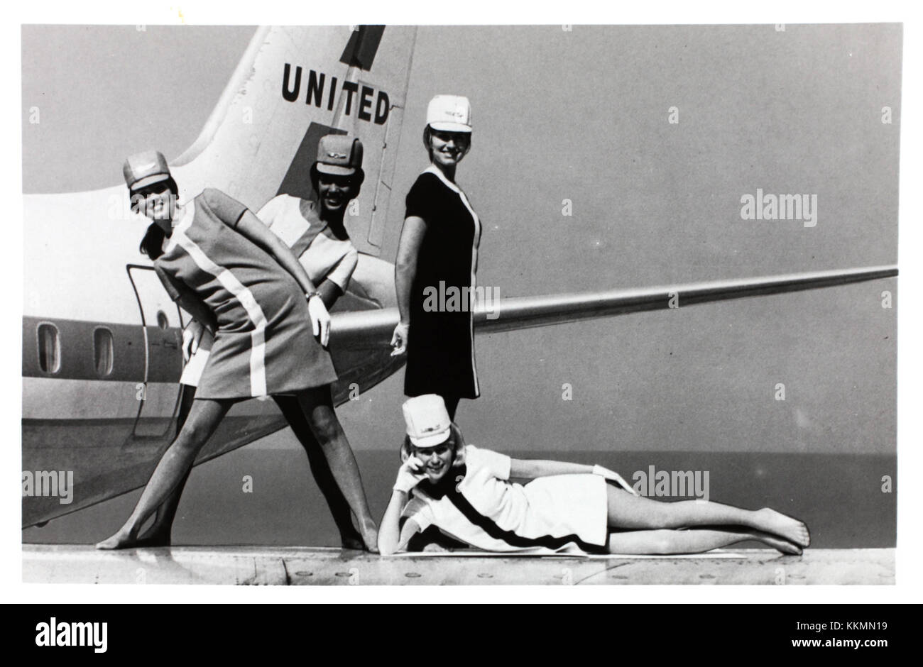 This image features United Airlines stewardesses in 1968, highlighting their role in air travel during this era. The photograph captures the uniforms and professionalism of flight attendants in the mid-20th century. Stock Photo