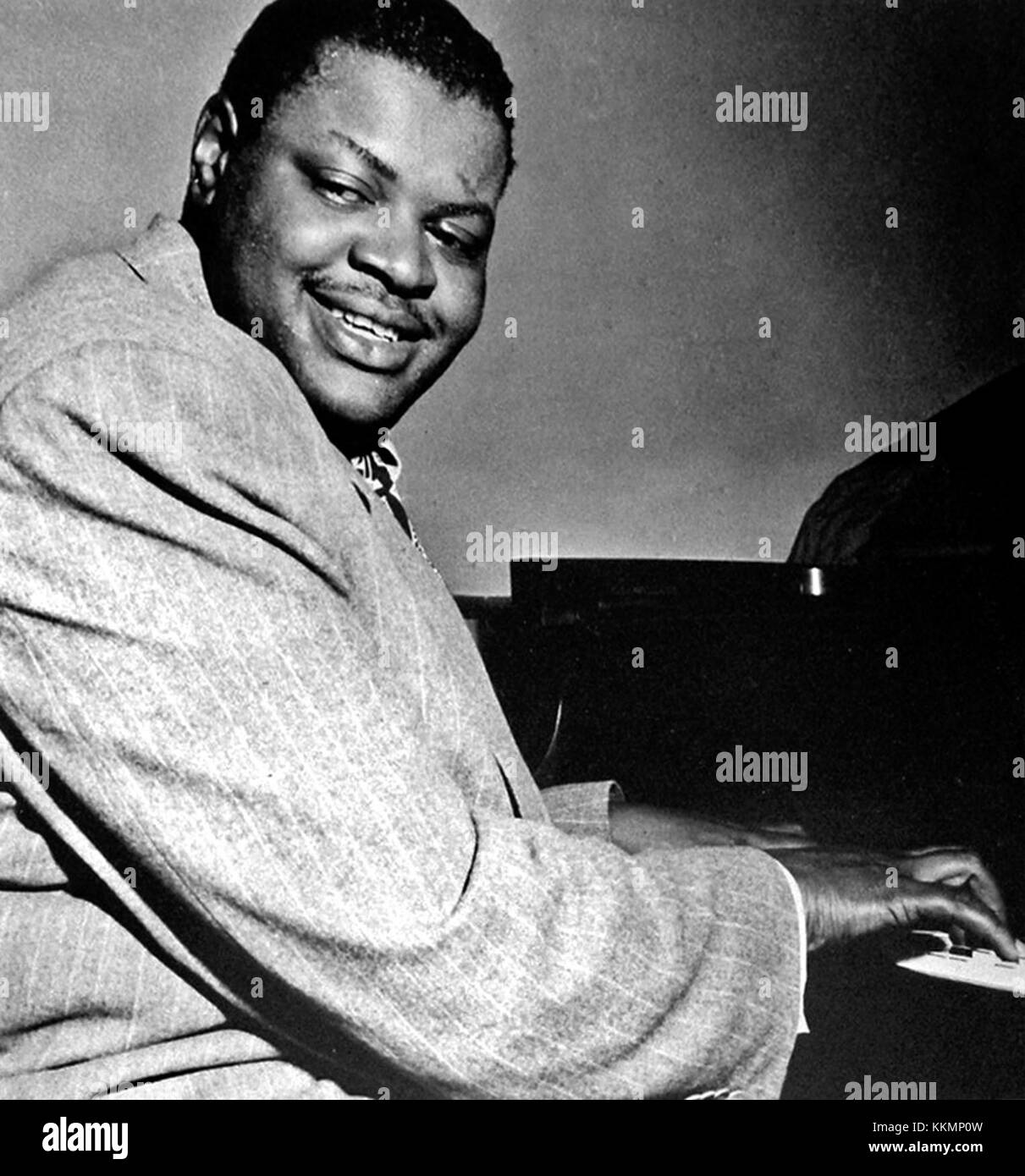 Oscar Peterson, one of the most influential jazz pianists of the 20th century, is captured performing in 1950, showcasing his virtuosity and impact on jazz music. Stock Photo