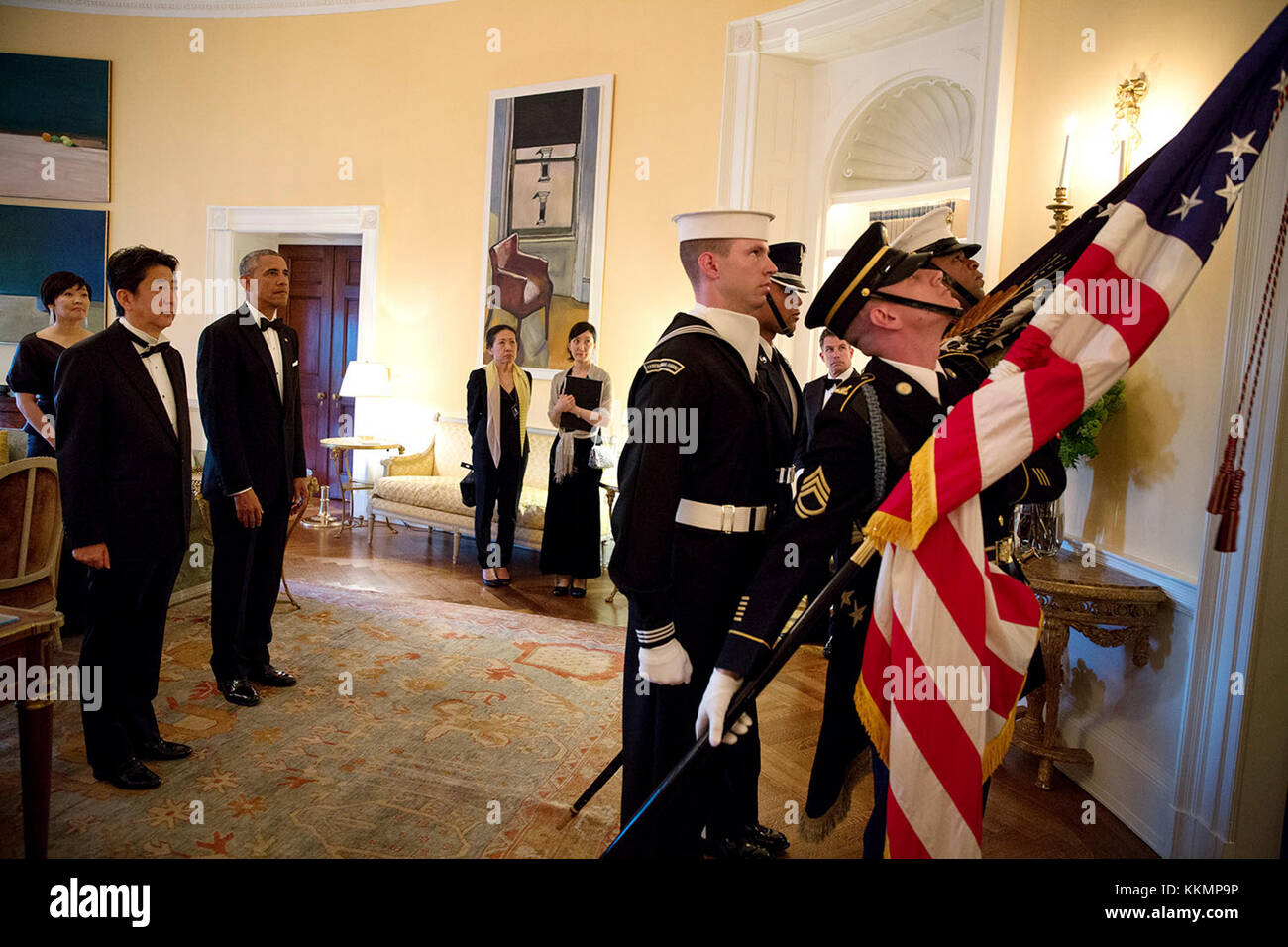 President Barack Obama and Prime Minister Shinzo Abe of Japan wait in the Yellow Oval Room to follow the Color Guard down the Grand Staircase to the State Dinner at the White House, April 28, 2015. (Official White House Photo by Pete Souza)  This official White House photograph is being made available only for publication by news organizations and/or for personal use printing by the subject(s) of the photograph. The photograph may not be manipulated in any way and may not be used in commercial or political materials, advertisements, emails, products, promotions that in any way suggests approva Stock Photo