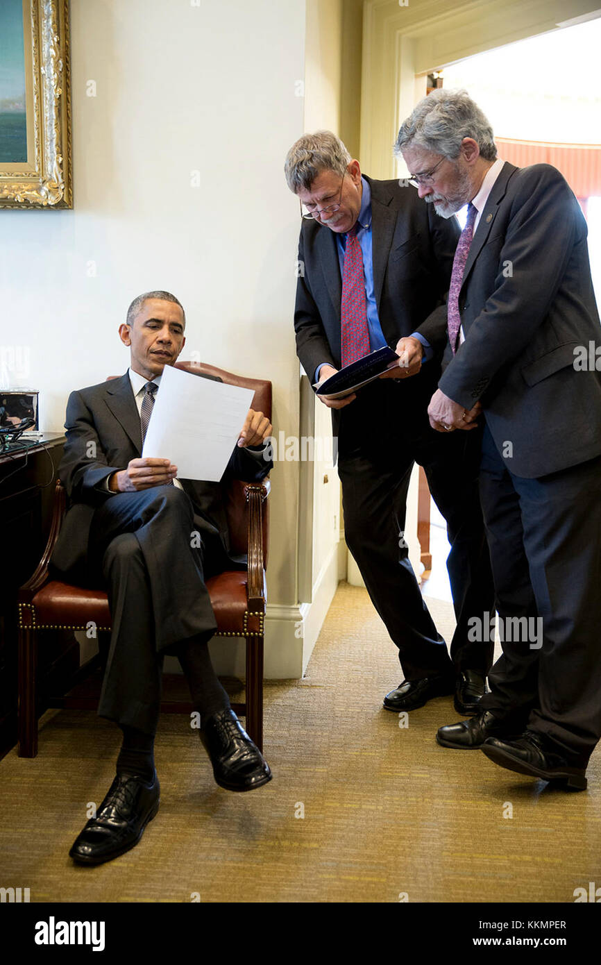 President Barack Obama confers with PCAST Cochairs Eric Lander and Dr. John Holdren, Director