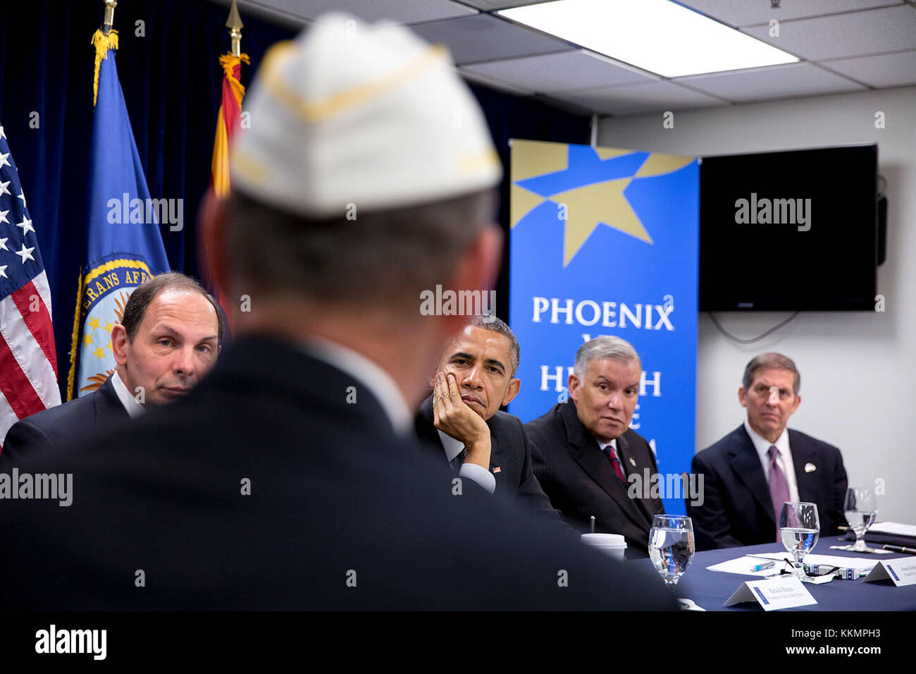 President Barack Obama and Veterans Affairs Secretary Robert A. McDonald, left, meet with veterans, VA employees and representatives from veterans groups for a briefing on the progress made to improve the Department of Veterans Affairs' ability to serve veterans in a timely and effective manner, at the Phoenix VA Medical Center in Phoenix, Ariz., March 13, 2015. (Official White House Photo by Pete Souza)  This official White House photograph is being made available only for publication by news organizations and/or for personal use printing by the subject(s) of the photograph. The photograph ma Stock Photo