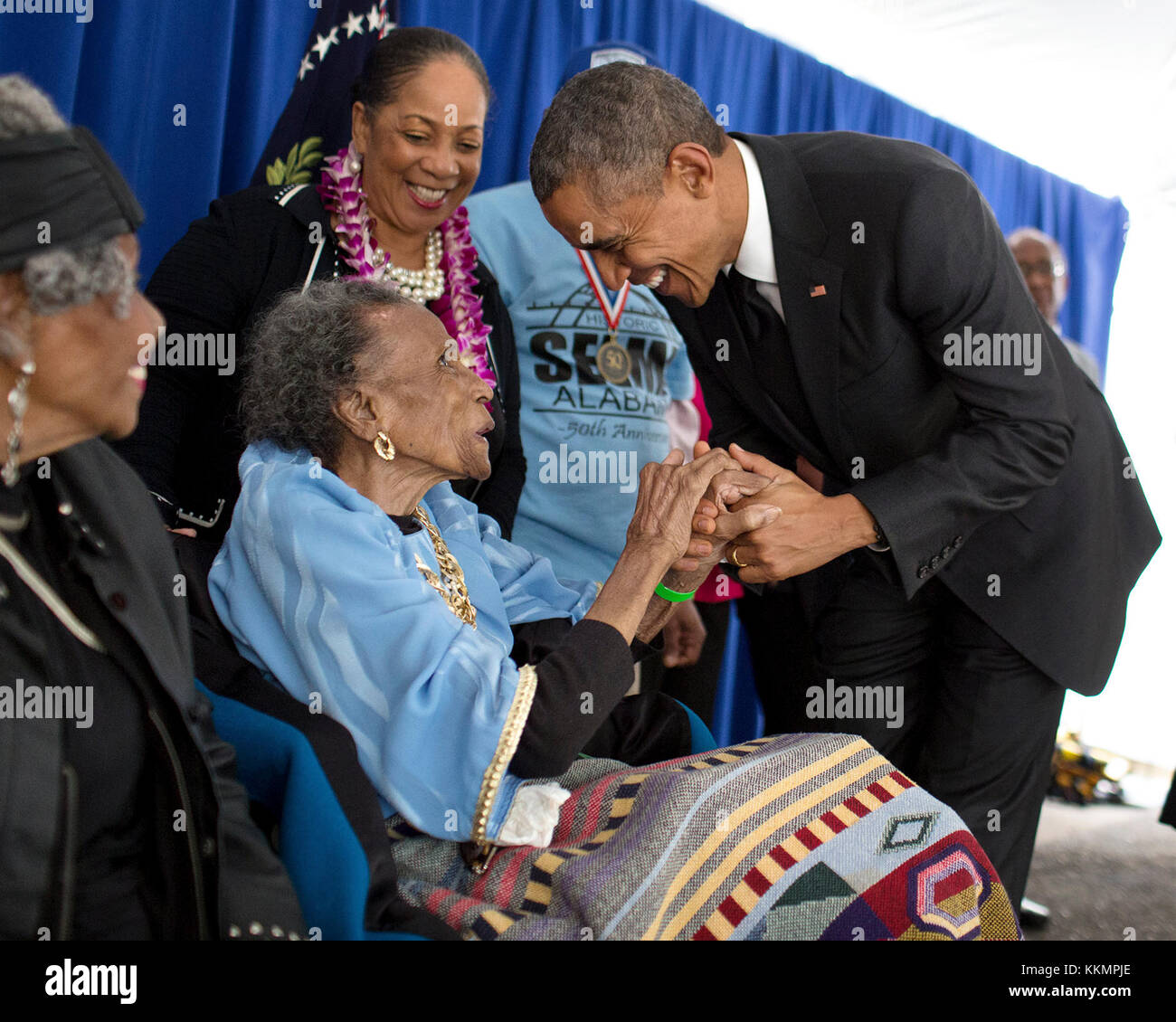 President Barack Obama greets former foot soldier Amelia Boynton Robinson, 103 years old, backstage before an event to commemorate the 50th Anniversary of Bloody Sunday and the Selma to Montgomery civil rights marches, at the Edmund Pettus Bridge in Selma, Ala., March 7, 2015. (Official White House Photo by Pete Souza)  This official White House photograph is being made available only for publication by news organizations and/or for personal use printing by the subject(s) of the photograph. The photograph may not be manipulated in any way and may not be used in commercial or political material Stock Photo