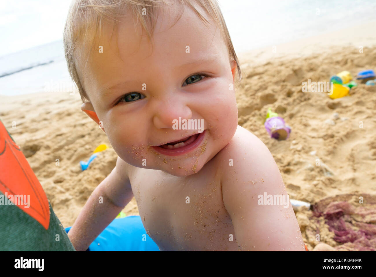 One Year Old On Beach Stock Photo