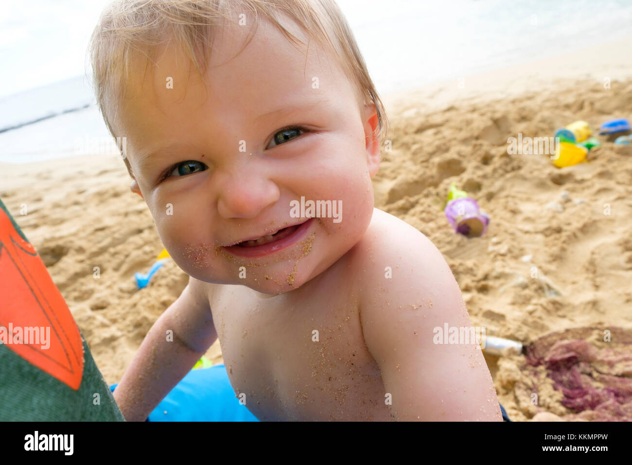 One Year Old On Beach Stock Photo