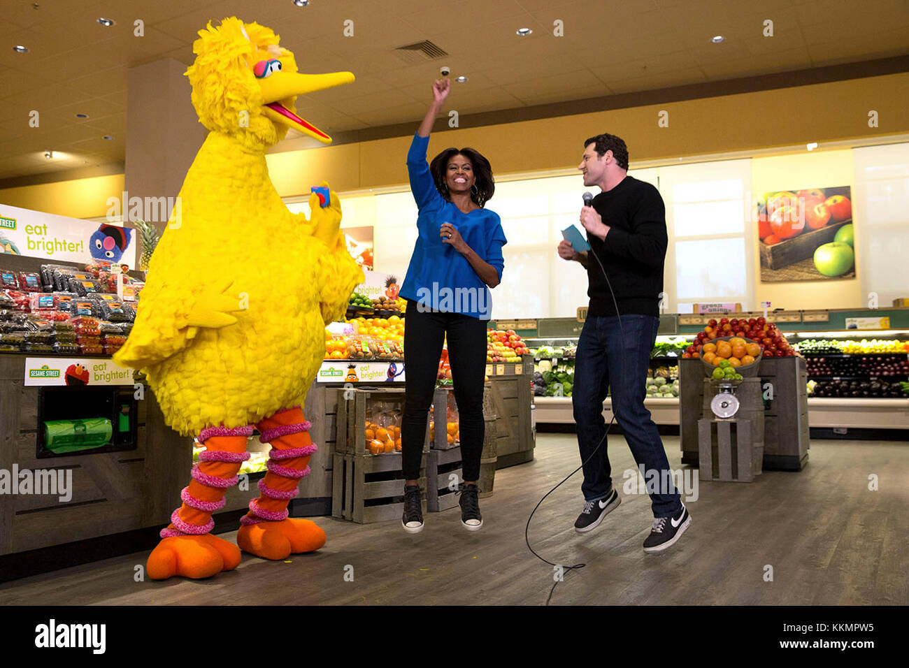 First Lady Michelle Obama participates in a 'Let's Move!' Funny or Die game show taping with Billy Eichner of Billy on the Street and Big Bird at Safeway in Washington, D.C., Jan. 12, 2015. (Official White House Photo by Amanda Lucidon)  This official White House photograph is being made available only for publication by news organizations and/or for personal use printing by the subject(s) of the photograph. The photograph may not be manipulated in any way and may not be used in commercial or political materials, advertisements, emails, products, promotions that in any way suggests approval or Stock Photo